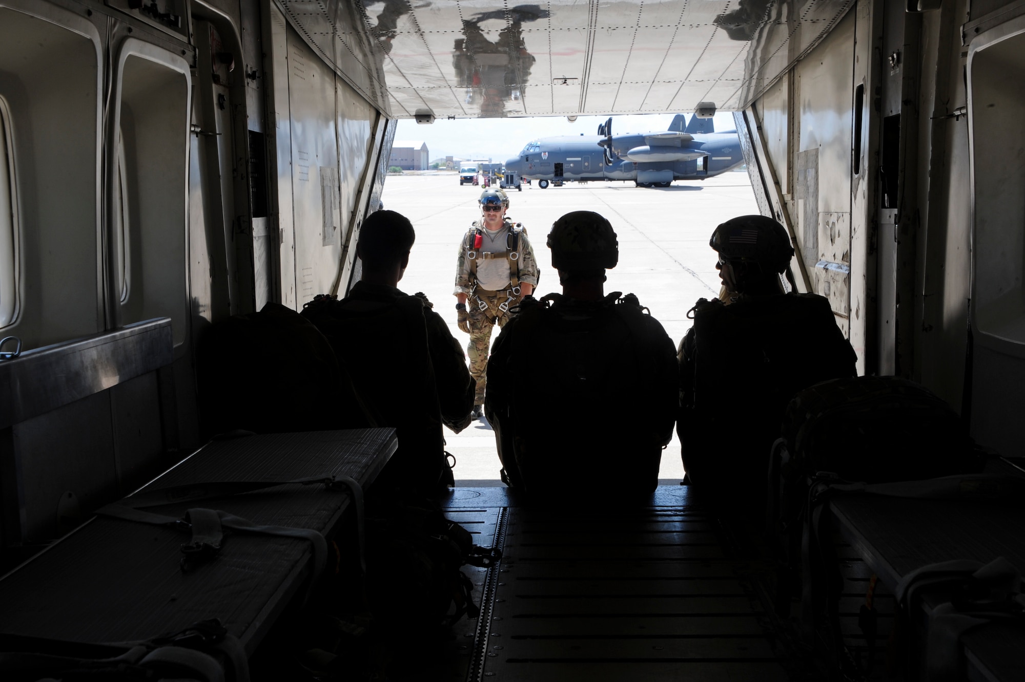 U.S. Airmen Prepare to board a C-23 Sherpa during the Military Freefall Jumpmaster Course at Davis-Monthan Air Force Base, Ariz., June 28, 2016. The course will graduate 12 Airmen at the end of its fifth 3-week-long rotation; reaching a total number of 58 certified jumpmasters. (U.S. Air Force photo by Airman Nathan H. Barbour/Released)