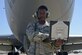 Senior Airman Tomorian Montgomery, a KC-135 Stratotanker crew chief with the 6th Aircraft Maintenance Squadron, pauses for a photo at MacDill Air Force Base, Fla., June 30, 2016. Montgomery’s grandfather, John Gilbert, was also a KC-135 crew chief during Vietnam. (U.S. Air Force photo by Airman 1st Class Mariette Adams)