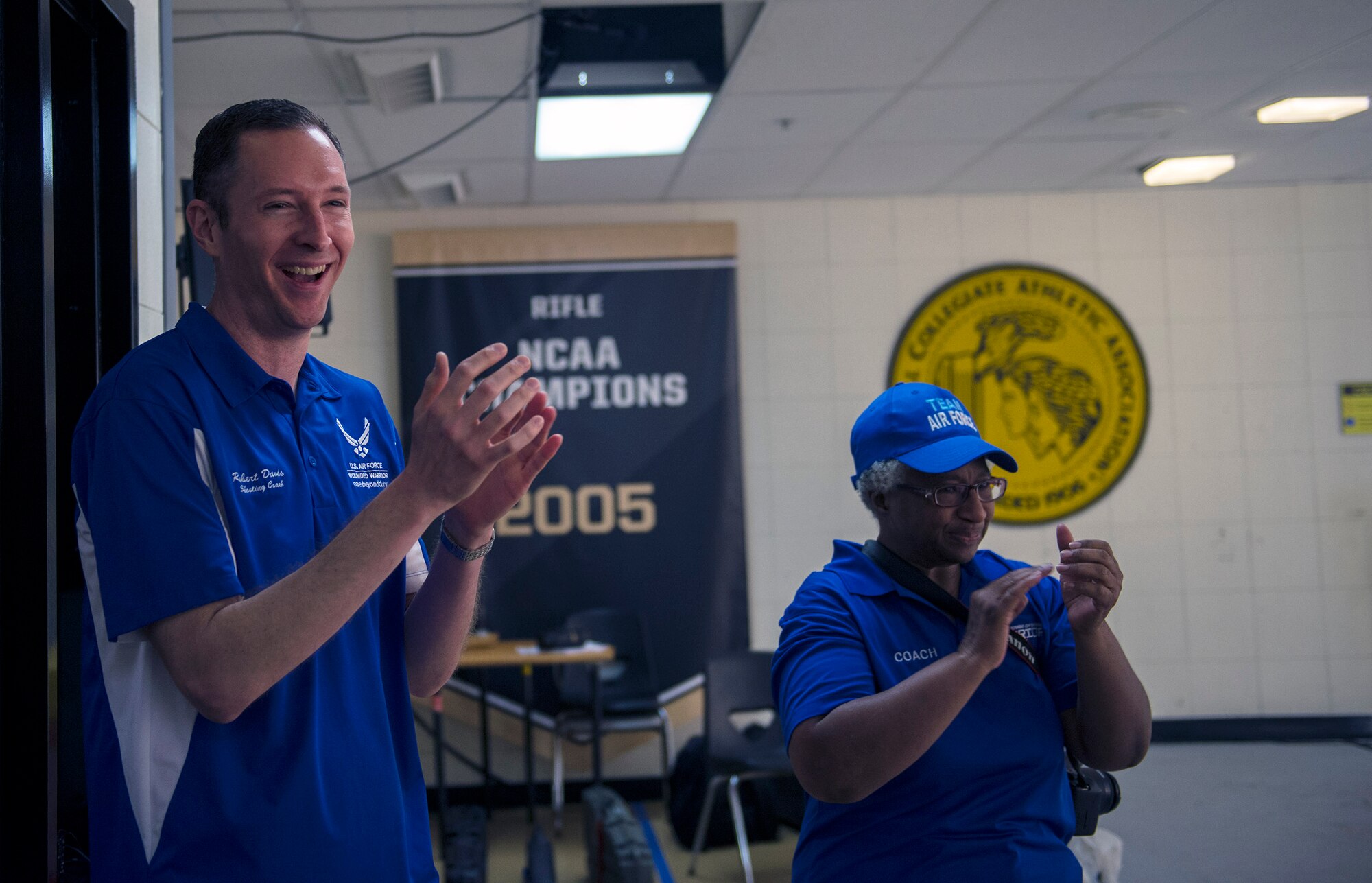 Team Air Force shooting competition coaches U.S. Air Force Maj. Robert Davis, 93d Air Ground Operations Wing director of complaints resolution, left, and retired Maj. Gwen Sheppard, celebrate during the 2016 Department of Defense Warrior Games shooting competition, June 19, 2016, at the United States Military Academy in West Point, N.Y. Davis coached approximately 75 athletes during his three-year tenure. (U.S. Air Force photo by Airman 1st Class Greg Nash/Released) 