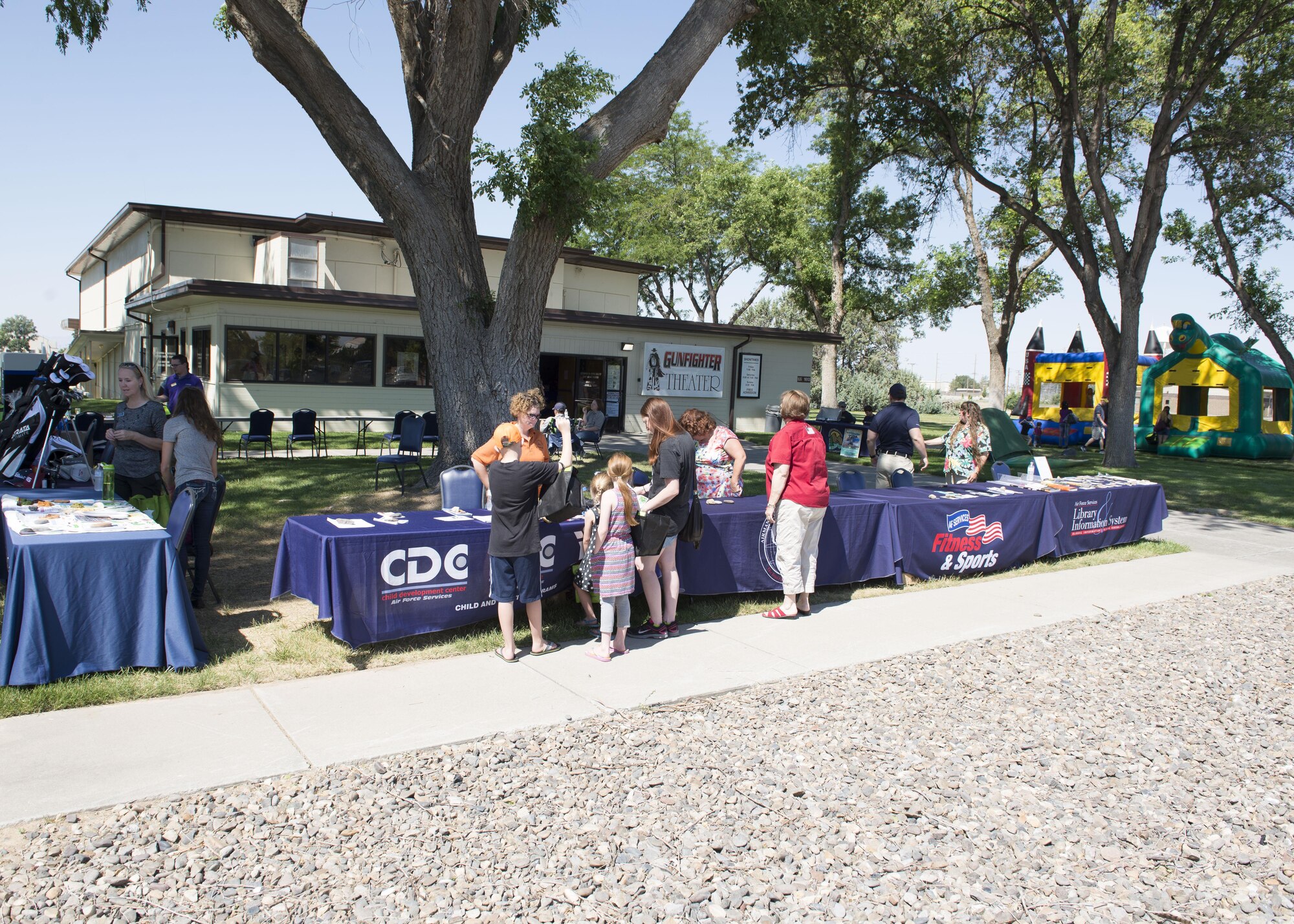 Guests enjoy the 366th Force Support Squadron summer social and Gunfighter Theater re-opening July 1, 2016, at Mountain Home Air Force Base, Idaho. The theater re-opens with four straight movies starting at 1 p.m. with Kung Fu Panda 3 and ending with London Has Fallen at 7 p.m. (U.S. Air Force photo by Airman 1st Class Chester Mientkiewicz/Released)