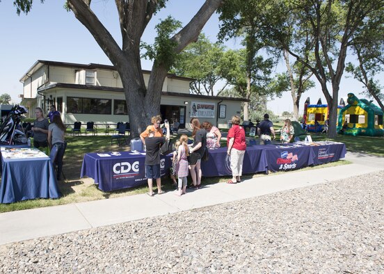 Guests enjoy the 366th Force Support Squadron summer social and Gunfighter Theater re-opening July 1, 2016, at Mountain Home Air Force Base, Idaho. The theater re-opens with four straight movies starting at 1 p.m. with Kung Fu Panda 3 and ending with London Has Fallen at 7 p.m. A complete list with more info can be found at: http://www.mhafbfun.com/theater/schedule.html (U.S. Air Force photo by Airman 1st Class Chester Mientkiewicz/Released)