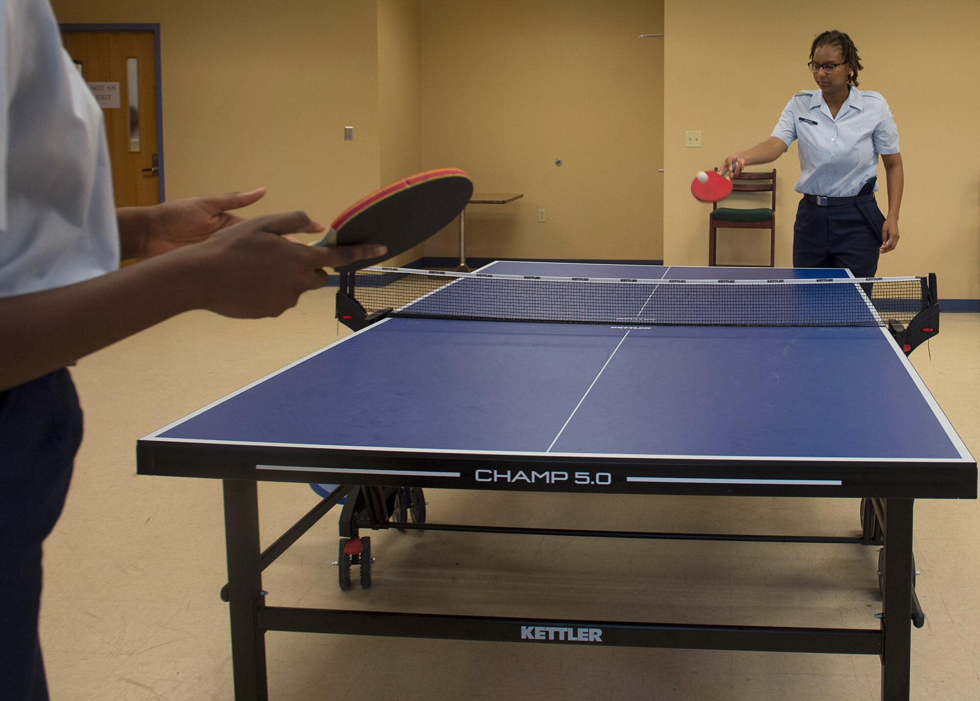 U.S. Air Force Junior ROTC cadets engage in a game of ping pong during a shadow day at Langley Air Force Base, Va., June 29, 2016. Throughout the day, cadets learned about military life and Langley missions. (U.S. Air Force photo by Airman 1st Class Kaylee Dubois)
