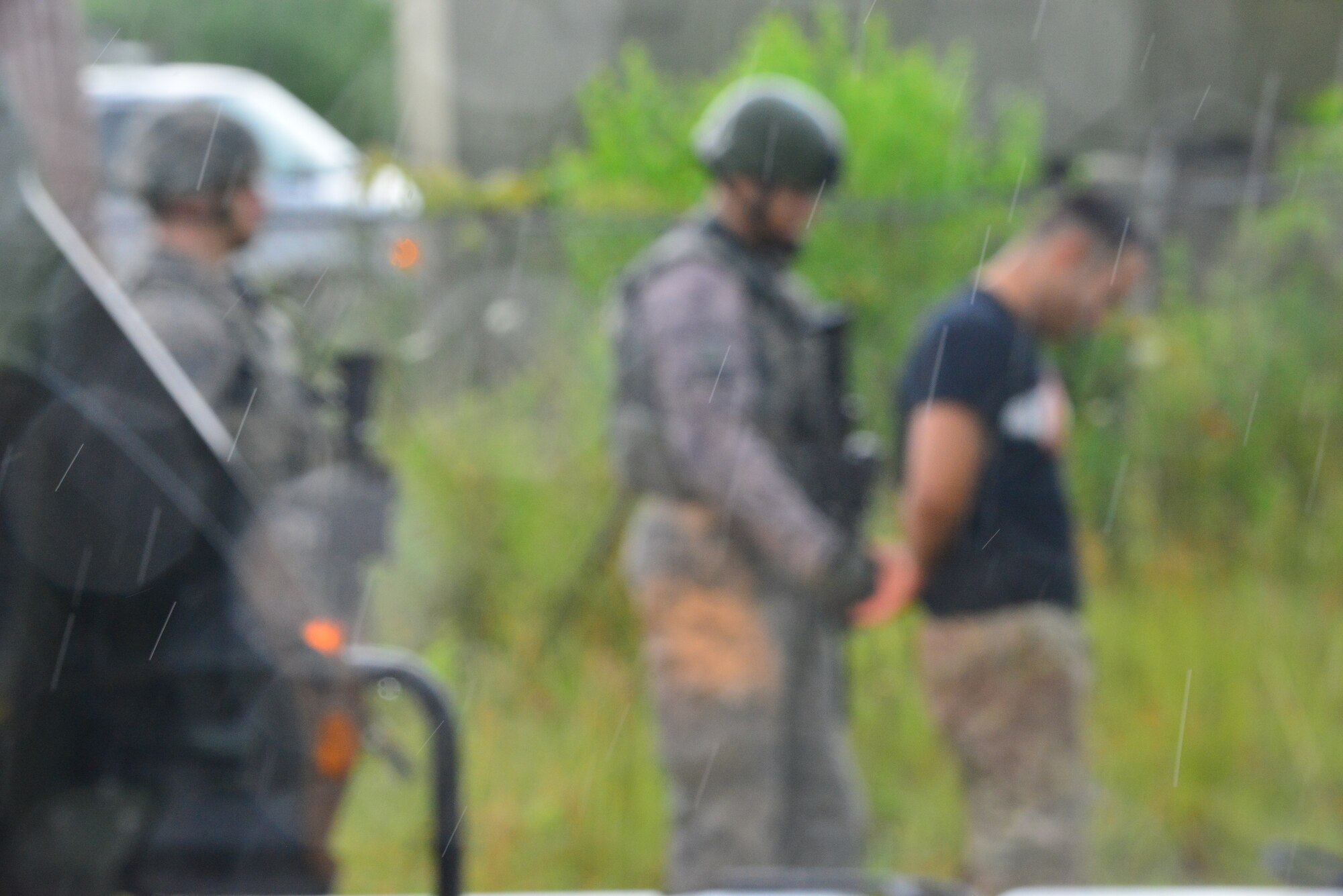 Staff Sgt. Juan Lopez Carrillo, 633rd Security Forces Squadron, Base Defense Operations Center operator detains a suspect during Combat Readiness Training at Langley Air Force Base, Va., June 28, 2016.  Expeditionary entry control point operations is just one of eight blocks of instruction taught at CRT, acting as a refresher/prerequisite for predeployment training.  (U.S. Air Force photo by/Tech. Sgt. Daylena S. Ricks)