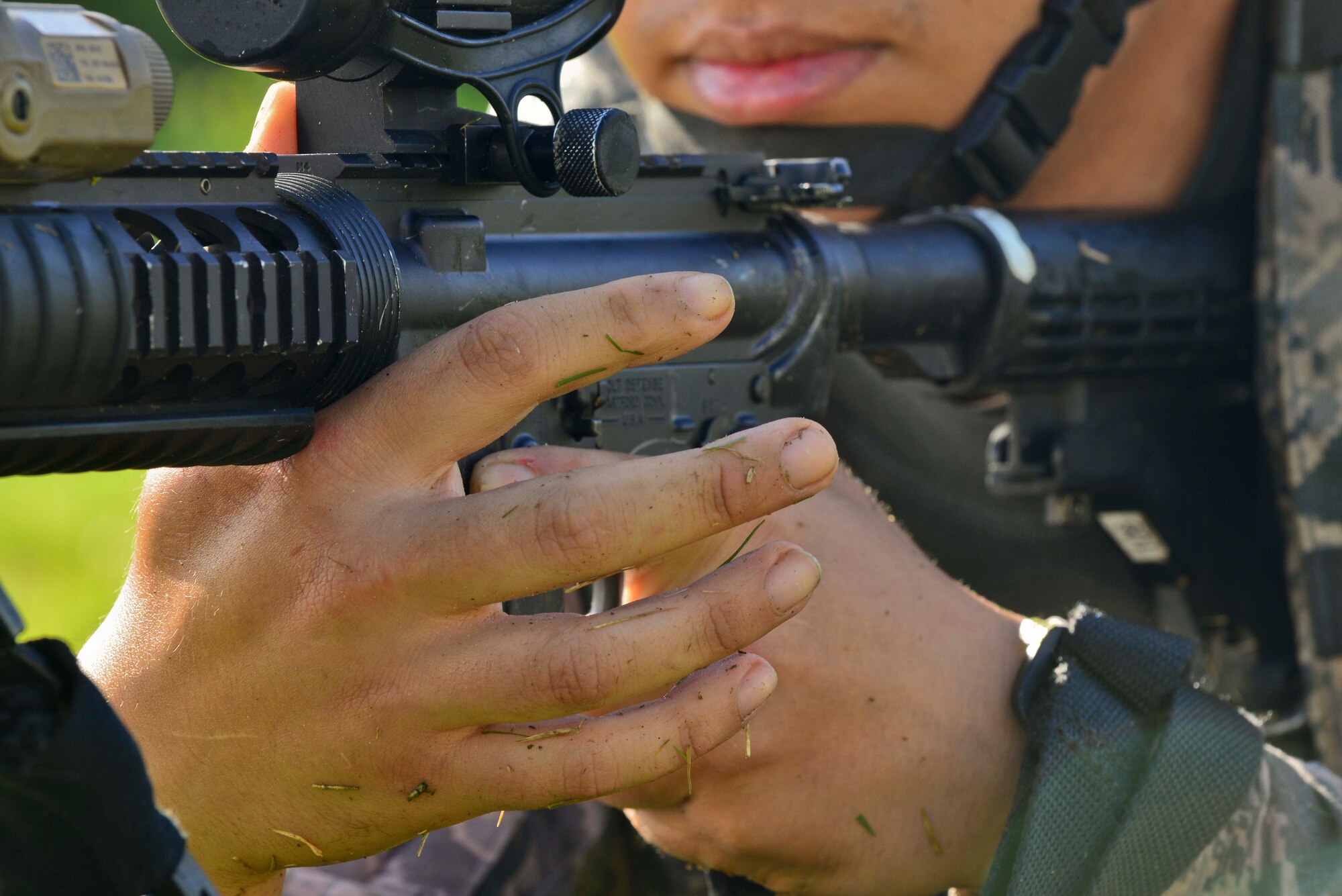 U.S. Air Force Staff Sgt. Juan Carrillo Lopez, 633rd Security Forces Squadron, Base Defense Operations Center operator adjusts his grip on his weapon after completing a high crawl to a defense position during Combat Readiness Training at Langley Air Force Base, Va., June 27, 2016.  CRT is a two-day course that sharpens basic field tactics for deploying SF Airmen.  (U.S. Air Force photo by/Tech. Sgt. Daylena S. Ricks)