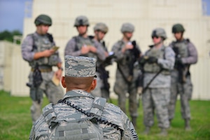 A squad of defenders from the 633rd Security Forces Squadron brief the operations order to U.S. Air Force Master Sgt. Christopher Ricks, 633 SFS, NCO in charge of training during Combat Readiness Training at Langley Air Force Base, Va., June 27, 2016.  CRT is a requirement before a SF member deploys acting as a refresher and prerequisite for predeployment training.  (U.S. Air Force photo by/Tech. Sgt. Daylena S. Ricks)