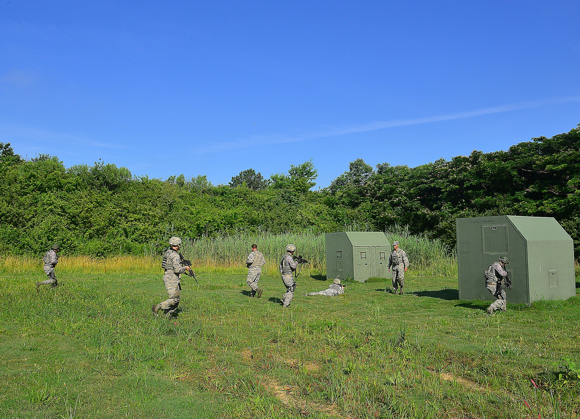 U.S. Air Force Master Sgt. Christopher Ricks, 633rd Security Forces Squadron, NCO in charge of training teaches team movement during Combat Readiness Training at Langley Air Force Base, Va., June 27, 2016.  Team movement skills are used to tactically move a SF squad from one location to another, safely.  (U.S. Air Force photo by/Tech. Sgt. Daylena S. Ricks)