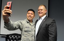 Senior Airman Kristian-Alan Amoranto, 78th Security Forces Squadron combat arms instructor, takes a selfie with retired Chief Master Sgt. of the Air Force James Roy during his recent visit to Robins. Roy, who served as the 16th Chief Master Sergeant of the Air Force, spoke to local Airman Leadership School students, June 27, 2016 prior to their graduation June 28. (U.S. Air Force photo by Tommie Horton)