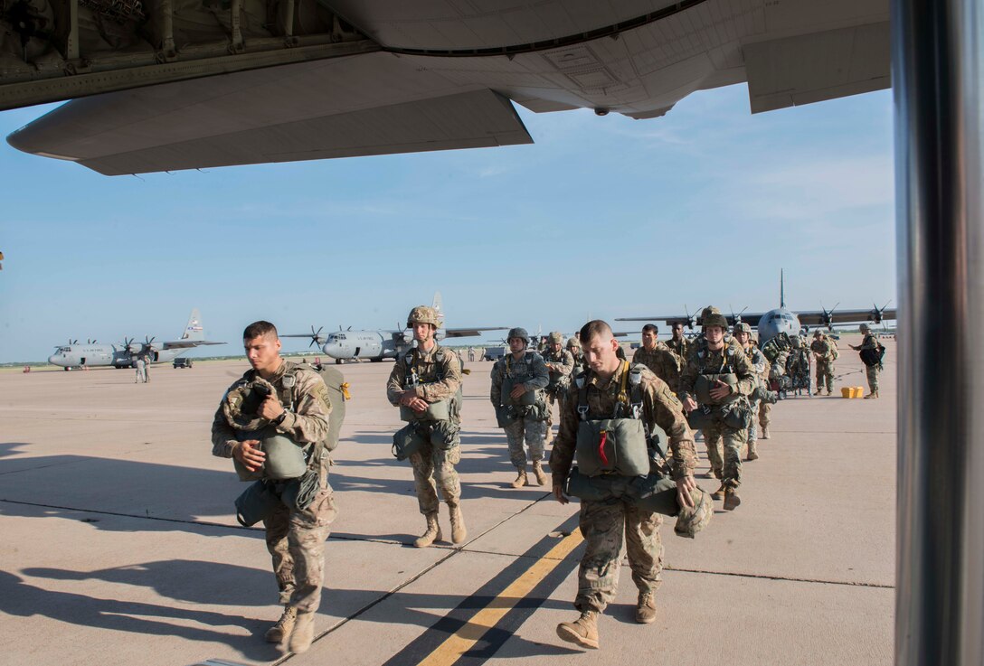 U.S. Army Soldiers assigned to the 82nd Airborne Division board a C-130J Super Hercules during a Joint Forcible Entry Exercise June 18, 2016, at Dyess Air Force Base, Texas. The Joint Forcible Entry Exercise is meant to maintain the bond between the Air Force and the Army to further national security. (U.S. Air Force photo by Airman 1st Class Austin Mayfield/ Released)