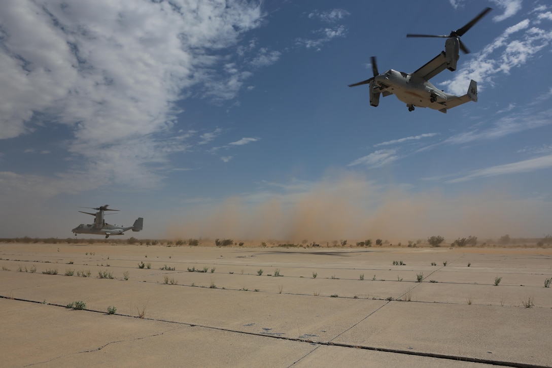 Two MV-22B Ospreys with Marine Medium Tiltrotor Squadron (VMM) 165 practice landing in confined areas during training in Holtville, Calif., June 29. VMM-165 conducts the training to familiarize new crew chiefs and pilots with missions that they would fly during a deployment. (U.S. Marine Corps photo by Pfc. Liah Kitchen/Released)