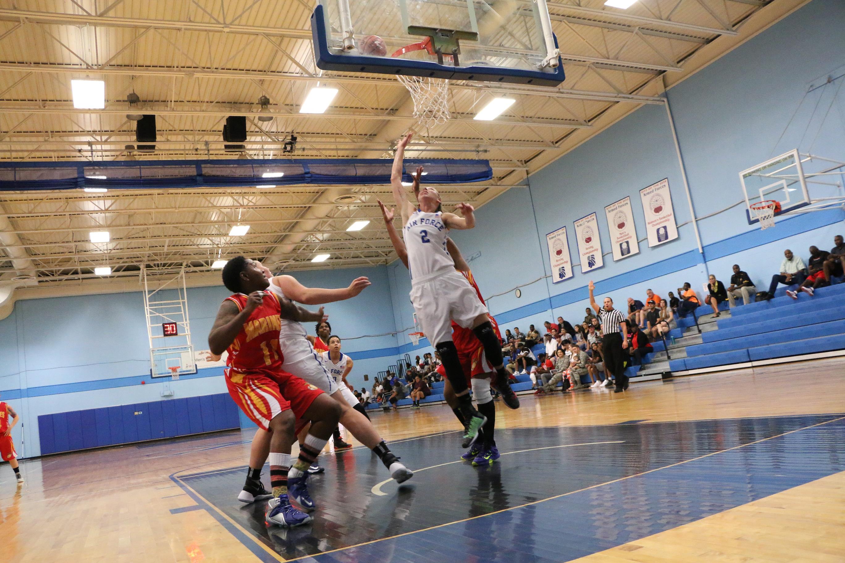 Airman 1st Class Charlene Stout of Dyess AFB (2) on the rebound as Air