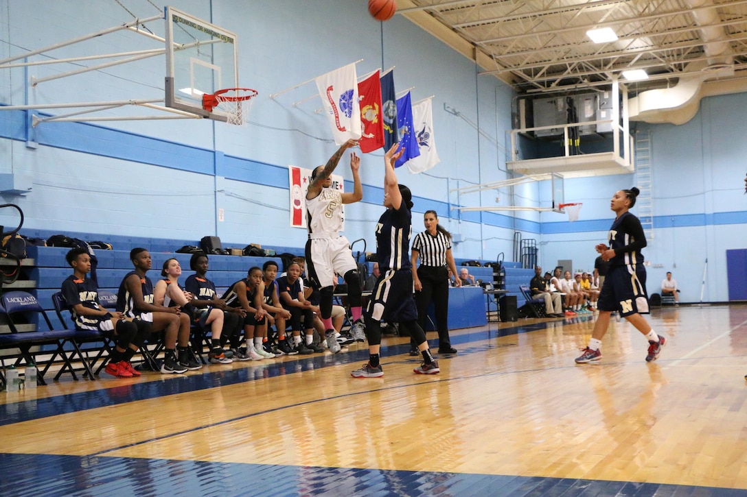 Army Spc. #5 Vanessa Laminson of Fort Bliss, Texas hits the jimper in the opening game against Navy during the 2016 Armed Forces Women's Basketball Championship at Joint Base San Antonio-Lackland AFB, Texas on 1 July.  