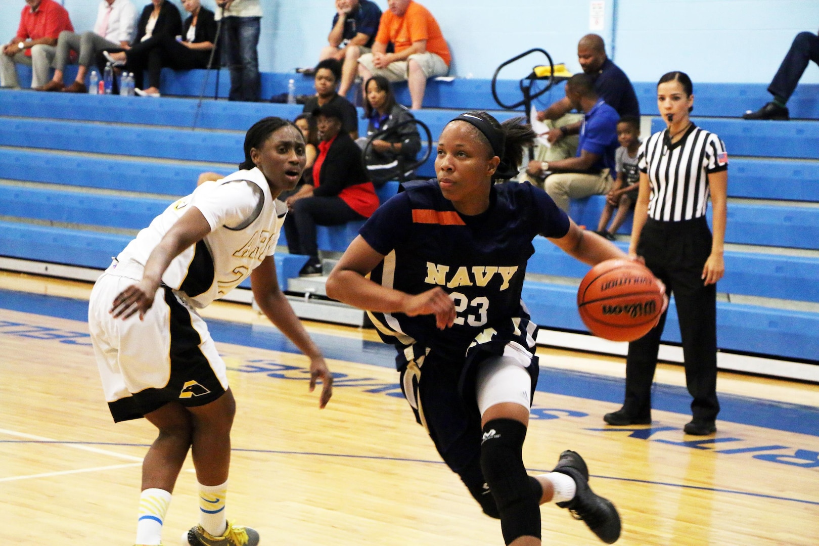Navy Seaman Jameika Hoskins (#23) of USS Rushmore drives the lane in their opening game against Armyduring the 2016 Armed Forces Women's Basketball Championship at Joint Base San Antonio-Lackland AFB, Texas on 1 July.  Army wins 90-68