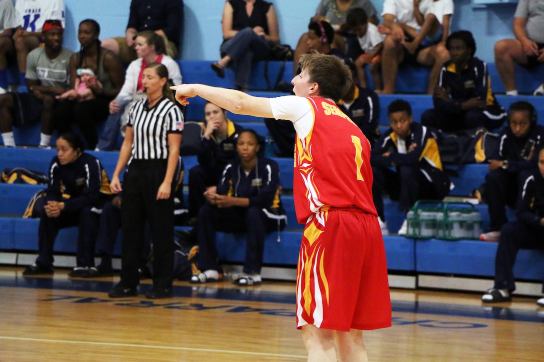 Marine Lance Cpl Alyshia Crawford leads the court against Air Force.  Air Force defeats Marine Corps 95-51 in the opening game of the 2016 Armed Forces Women's Basketball Championship at Joint Base San Antonio-Lackland AFB, Texas on 1 July.  