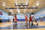 Coast Guard's Shaniqua Bennet of USCGC Eagle hits the jumper against Marine Corps in Game Five of the 2016 Armed Forces Women's Basketball Championship at Joint Base San Antonio-Lackland AFB, Texas on 3 July. Navy would defeat the Marine Corps 88-64.  