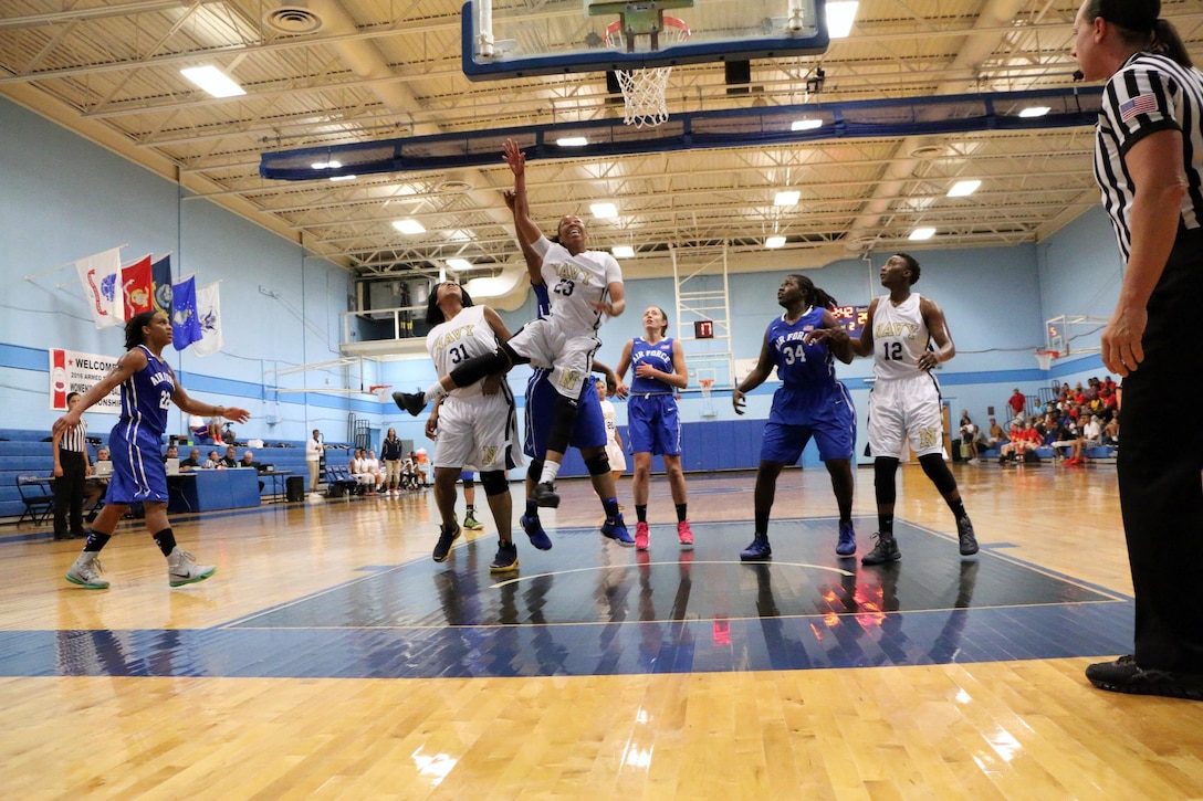 Navy Seaman Jameika Hoskins (#23) of USS Rushmore drives the lane against Air Force during game three of the 2016 Armed Forces Women's Basketball Championship at Joint Base San Antonio-Lackland AFB, Texas on 1 July. Air Force would win 64-61 in exciting action 