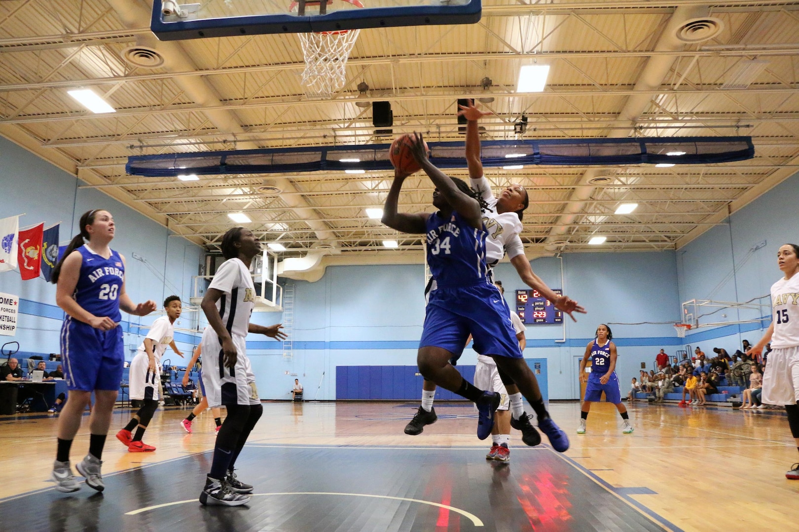 Air Force Staff Sgt. Charmaine Clark (#34) of Robins AFB, Ga. drives the lane against Navy during the 2016 Armed Forces Women's Basketball Championship at Joint Base San Antonio-Lackland AFB, Texas on 2 July.  Air Force would win the contest 64-61.