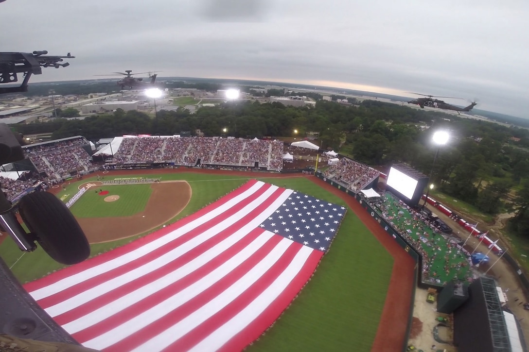 UH-60 Blackhawk helicopters fly over the field before a baseball game between the Florida Marlins and the Atlanta Braves at Fort Bragg, N.C., July 3, 2016. Army photo by Sgt. Anthony Hewitt 