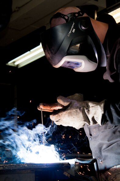 Senior Airman Richard Forney, 51st Maintenance Squadron aircraft metals technology journeyman, welds a sheet of metal at Osan Air Base, Republic of Korea, June 28, 2016. Forney builds custom parts for aircraft and supporting equipment. Forney is assigned to the metals technology shop and is part of the fabrication flight, which also has non-destructive inspection and structural maintenance. Fabrication flight Airmen identify, repair and build parts to working order so that Osan airframes are ready to fight tonight. (U.S. Air Force photo by Staff Sgt. Jonathan Steffen/Released)