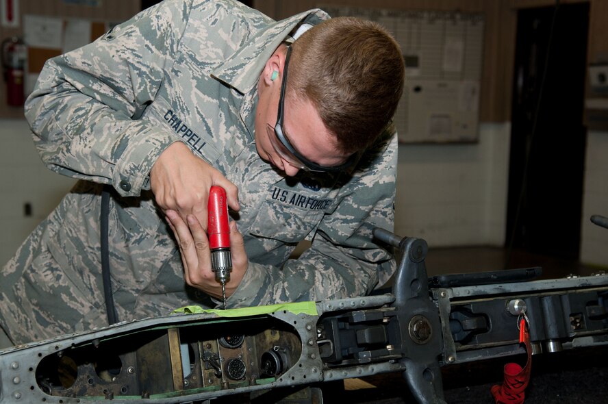 Airman Jared Chappell, 51st Maintenance Squadron aircraft structural maintenance, drills holes into an A-10 Thunderbolt II pylon at Osan Air Base, Republic of Korea, June 28, 2016. Chappell was repairing a crack in the pylon to return it to full mission capability. Chappell is assigned to structural maintenance shop and is part of the fabrication flight which also has non-destructive inspection and metals technology. Fabrication flight Airmen identify, repair and build parts to working order so that Osan airframes are ready to fight tonight. (U.S. Air Force photo by Staff Sgt. Jonathan Steffen/Released)