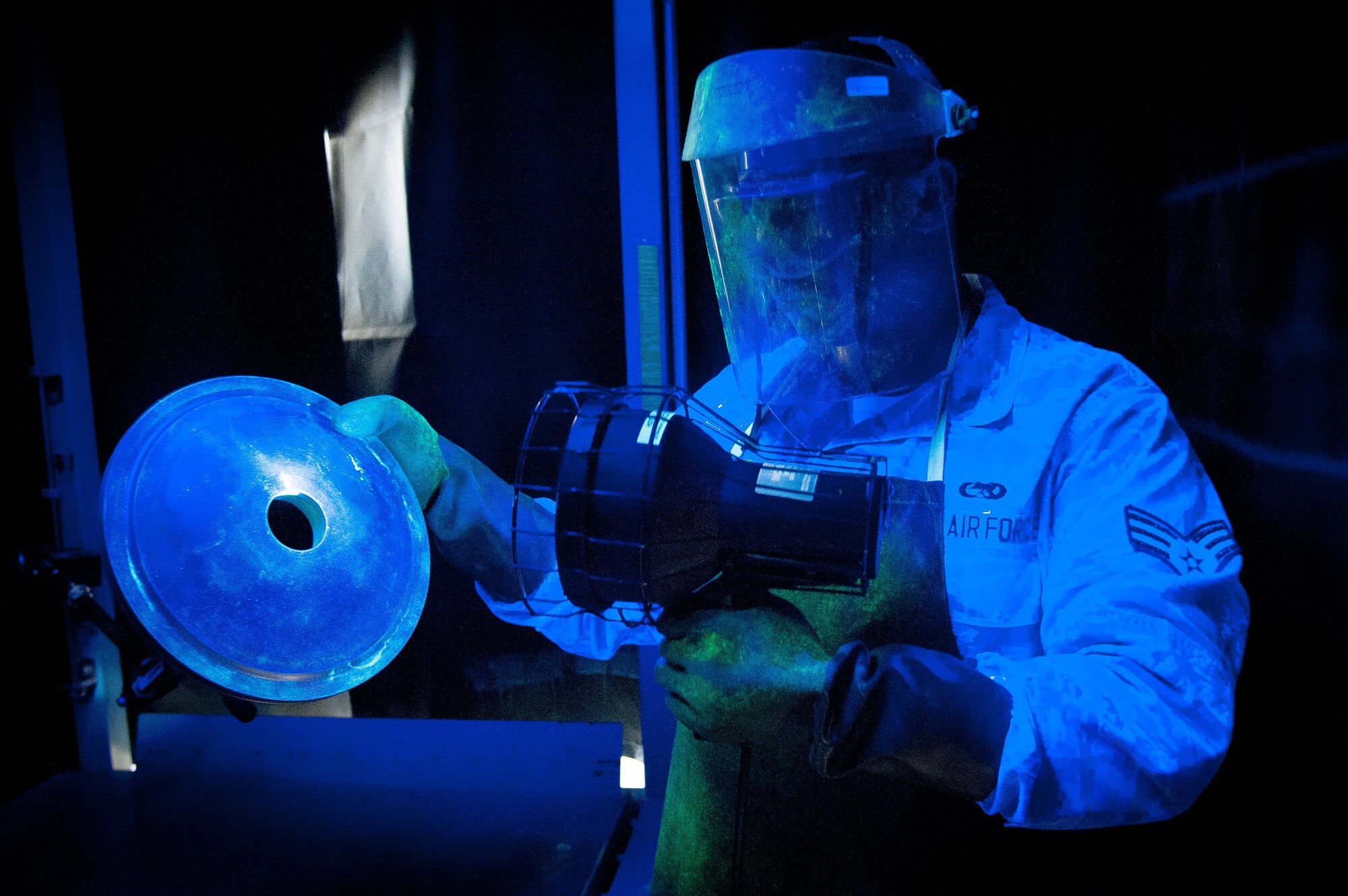 Senior Airman Nathan Talamantez, 51st Maintenance Squadron non-destructive inspection journeyman, inspects a brake housing for a cracks at Osan Air Base, Republic of Korea, June 28, 2016. Talamantez identifies damages aircraft parts before returning them to be repaired or replaced. Talamantez is assigned to the non-destructive inspection shop and is part of the fabrication flight which also has structural maintenance shop and metals technology. Fabrication flight Airmen identify, repair and build parts to working order so that Osan airframes are ready to fight tonight. (U.S. Air Force photo by Staff Sgt. Jonathan Steffen/Released)