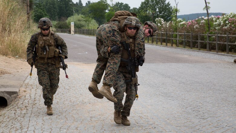 U.S. Marine Corps Lance Cpl. Brian Jennings, an infantry assault Marine with Special Purpose Marine Air-Ground Task Force-Crisis Response-Africa, carries a simulated casualty to a vehicle for evacuation during a non-combatant evacuation operation at Santa Margarida, Portugal, June 23, 2016. The Marines were tasked as the quick response force during the exercise, supporting Portuguese soldiers during non-combatant evacuation operations. 