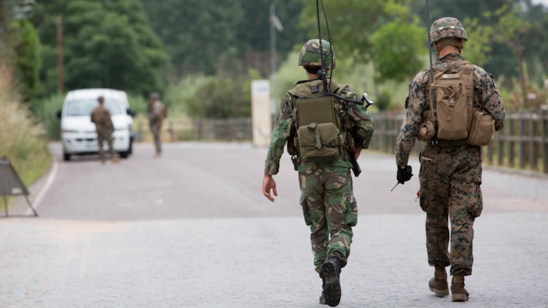 U.S. Marine Corps 2nd Lt. Kevin Ryan (right), a platoon commander with Special Purpose Marine Air-Ground Task Force-Crisis Response-Africa, coordinates with a Portuguese radio operator during a non-combatant evacuation operation at Santa Margarida, Portugal, June 23, 2016. Exercise Orion is an annual crisis response operation hosted by the Portuguese military, bringing together forces from Portugal, Spain and the U.S. to enhance interoperability among NATO forces. 