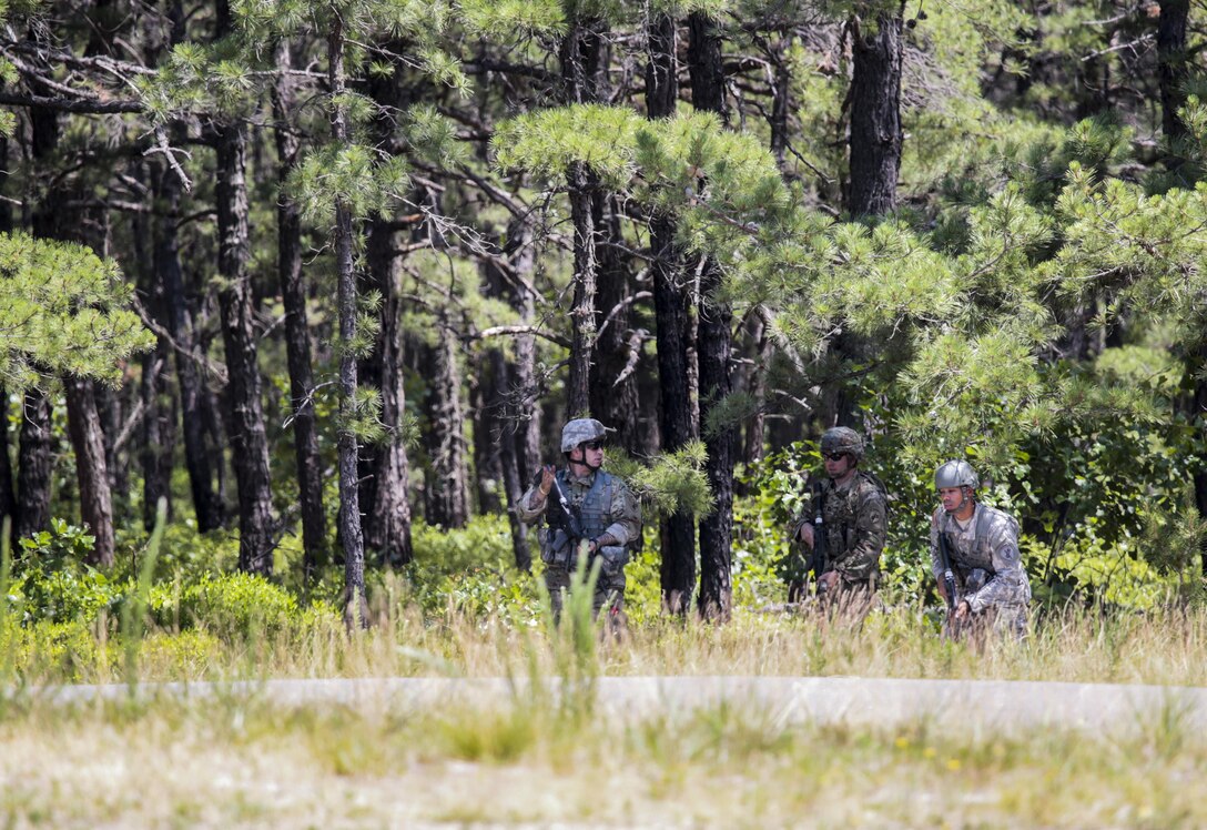 U.S. Army Reserve Soldiers from the 404th Civil Affairs Battalion maneuver towards a friendly town during Exercise Gridiron at Joint Base McGuire-Dix-Lakehurst, N.J., June 27, 2016. (U.S. Air National Guard photo by Tech. Sgt. Matt Hecht/Released)