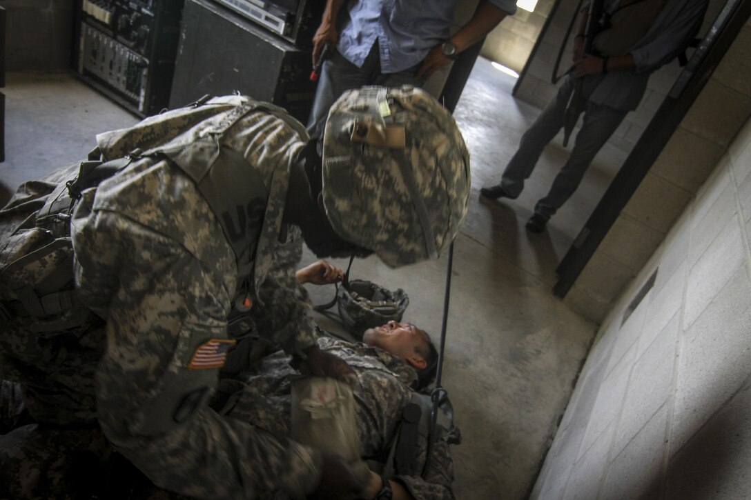 A U.S. Army Reserve Soldier from the 404th Civil Affairs Battalion tends to a simulated casualty during Exercise Gridiron at Joint Base McGuire-Dix-Lakehurst, N.J., June 27, 2016. (U.S. Air National Guard photo by Tech. Sgt. Matt Hecht/Released)