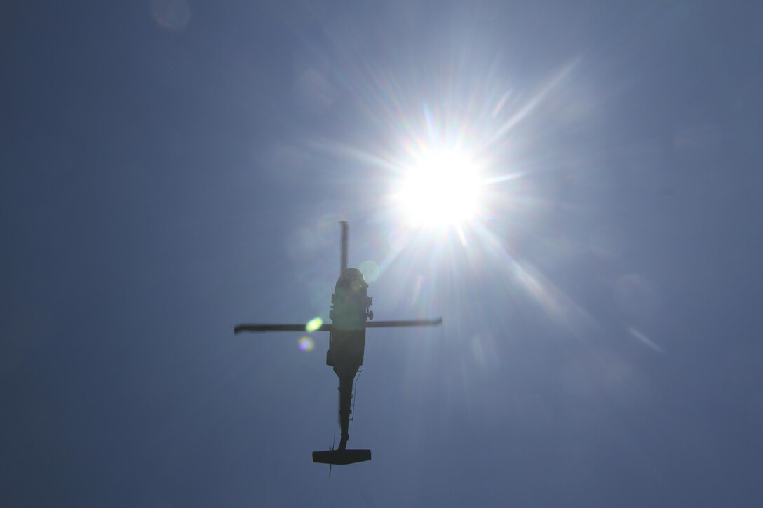 A New Jersey Army National Guard UH-60 Black Hawk MEDEVAC helicopter flies overhead before picking up simulated casualties during Exercise Gridiron at Joint Base McGuire-Dix-Lakehurst, N.J., June 27, 2016. (U.S. Air National Guard photo by Tech. Sgt. Matt Hecht/Released)