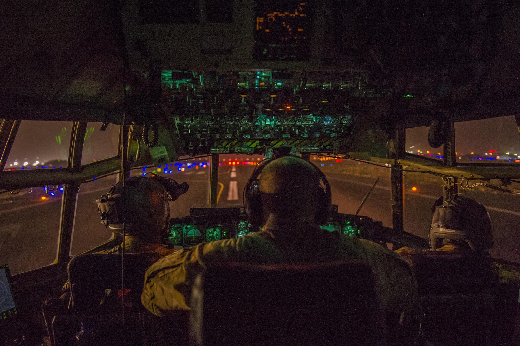 U.S. Air Force pilots from the Alaska Air National Guard's 144th Airlift Squadron prepare to take off in a C-130 Hercules at an undisclosed location in Southwest Asia, June 17, 2016. The transport mission was one of the last combat missions during the 144th AS's final C-130 deployment. (U.S. Air Force photo by Staff Sgt. Douglas Ellis/Released)