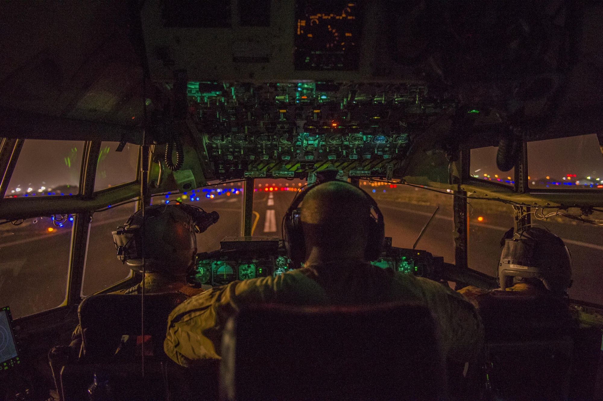 U.S. Air Force pilots from the Alaska Air National Guard's 144th Airlift Squadron prepare to take off in a C-130 Hercules at an undisclosed location in Southwest Asia, June 17, 2016. The transport mission was one of the last combat missions during the 144th AS's final C-130 deployment. (U.S. Air Force photo by Staff Sgt. Douglas Ellis/Released)