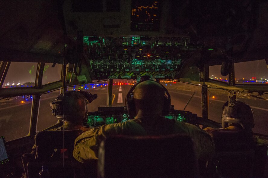 Pilots from the Alaska Air National Guard's 144th Airlift Squadron prepare to take off in a C-130 Hercules at an undisclosed location in Southwest Asia, June 17, 2016. The transport mission was one of the last combat missions during the 144th AS's final C-130 deployment. (U.S. Air Force photo/Staff Sgt. Douglas Ellis)