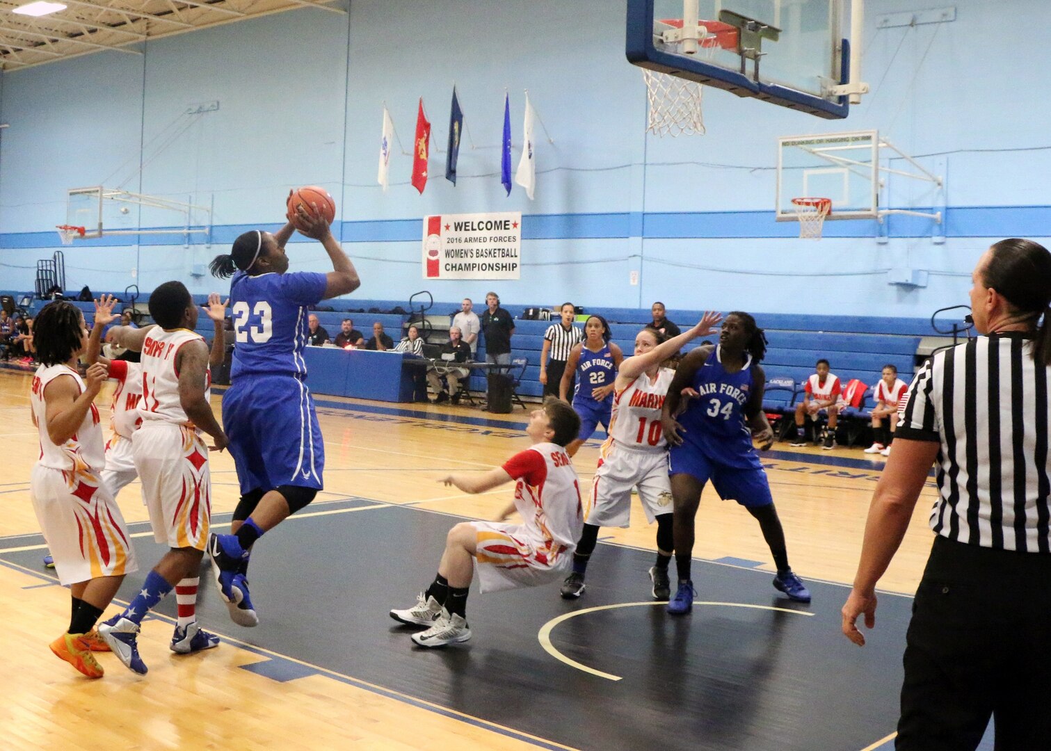 Air Force Staff Sgt. Tiffany Guthrie (#23) of JB Elmendorf–Richardson, Alaska shoots over Marine Corps in game seven of the 2016 Armed Forces Women's Basketball Championship at Joint Base San Antonio-Lackland AFB, Texas on 4 July.  Air Force wins the contest 81- 43.