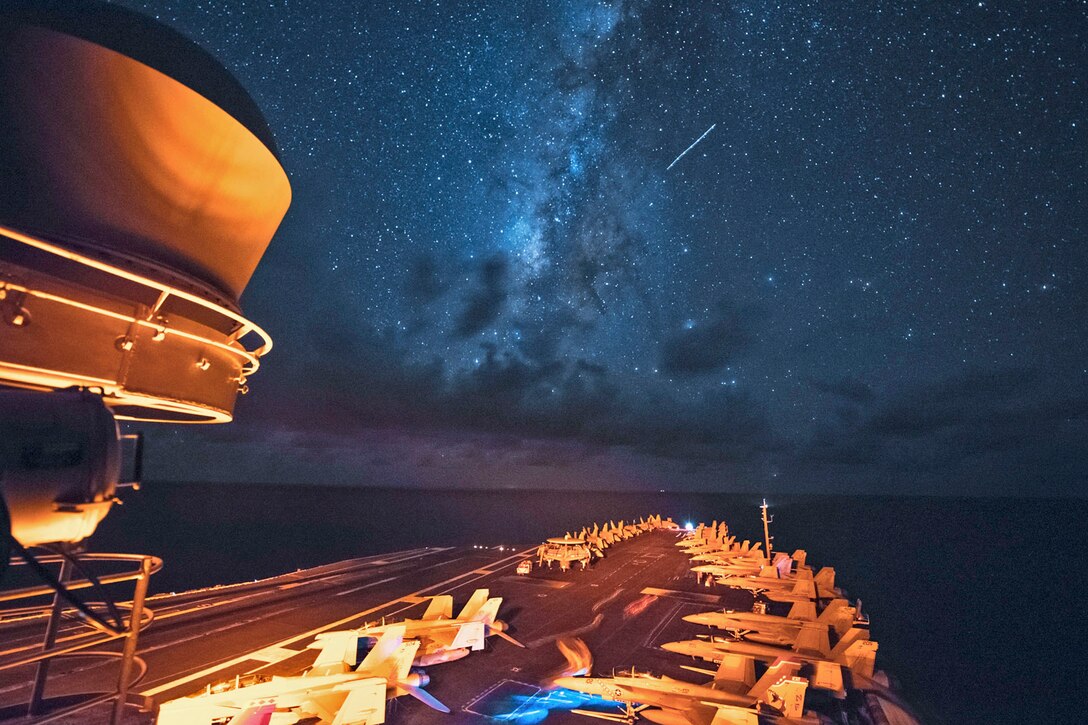 Aircraft, shooting stars and planets are visible from the flight deck of the aircraft carrier USS Ronald Reagan as it transits the Luzon Strait, July 1, 2016. The Ronald Reagan is on patrol in the U.S. 7th Fleet area of responsibility, supporting security and stability in the Indo-Asia-Pacific region. Navy photo by Petty Officer 3rd Class Ryan N. McFarlane