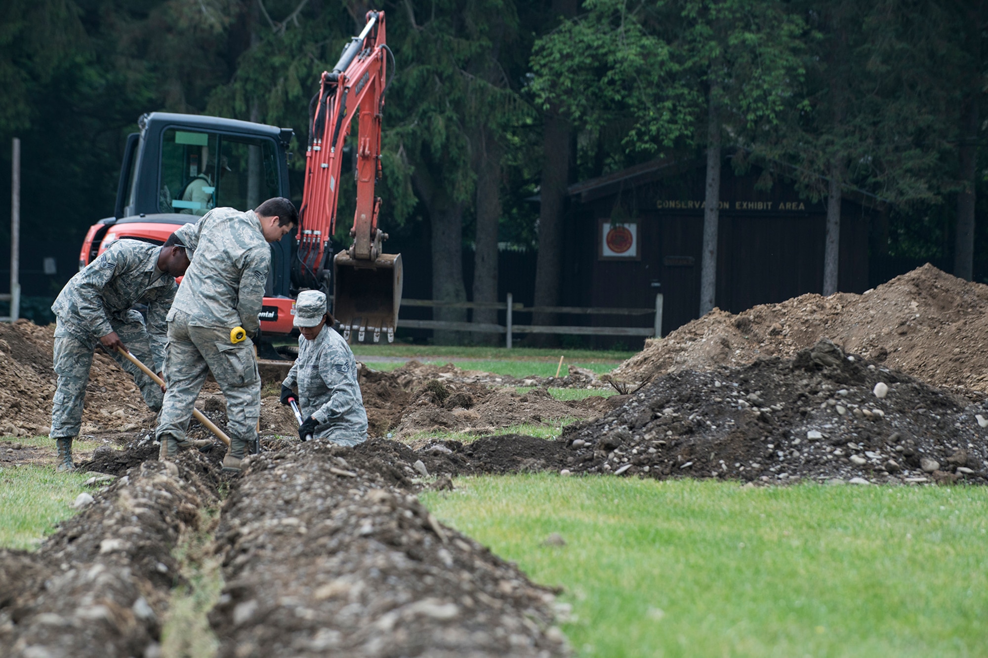 U.S. Air Force Airmen from the 307th Civil Engineering Squadron (CES) prepare to lay new plumbing and electrical lines at the Chenango County Fairgrounds, Norwich, N.Y., June 28, 2016. The 307th CES is an Air Force Reserve squadron assigned under the 307th Bomb Wing at Barksdale Air Force Base, La., and are in Norwich to participate in a community restoration project in support of the Innovative Readiness Training Program.  (U.S. Air Force photo by Master Sgt. Greg Steele/Released)