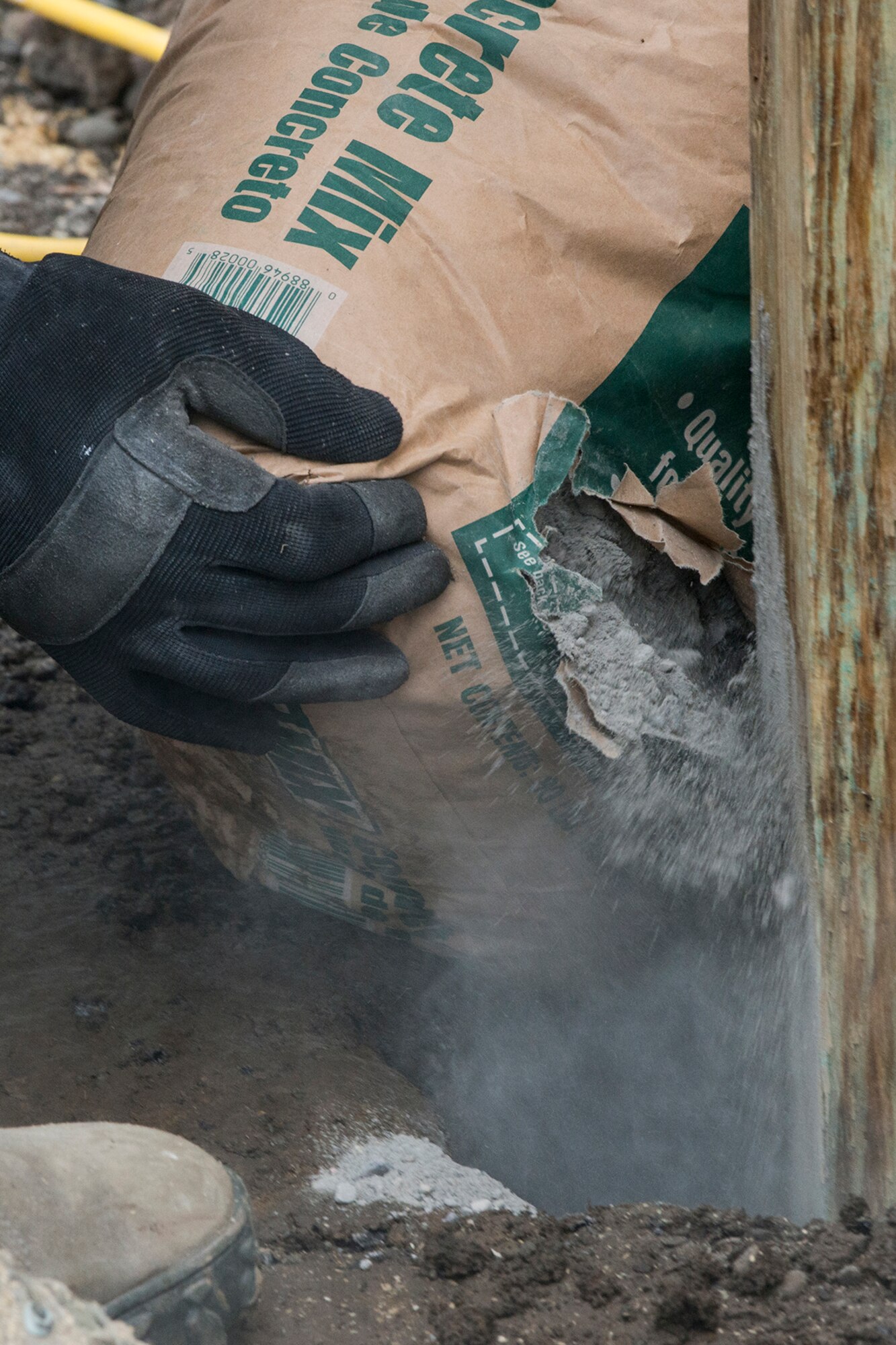 A U.S. Air Force Airman from the 307th Civil Engineering Squadron (CES) pours concrete into the base of a new set of stairs built at the Chenango County Fairgrounds, Norwich, N.Y., June 28, 2016. The 307th CES is an Air Force Reserve squadron assigned under the 307th Bomb Wing at Barksdale Air Force Base, La., and is in Norwich to participate in a community restoration project in support of the Innovative Readiness Training Program.  (U.S. Air Force photo by Master Sgt. Greg Steele/Released)