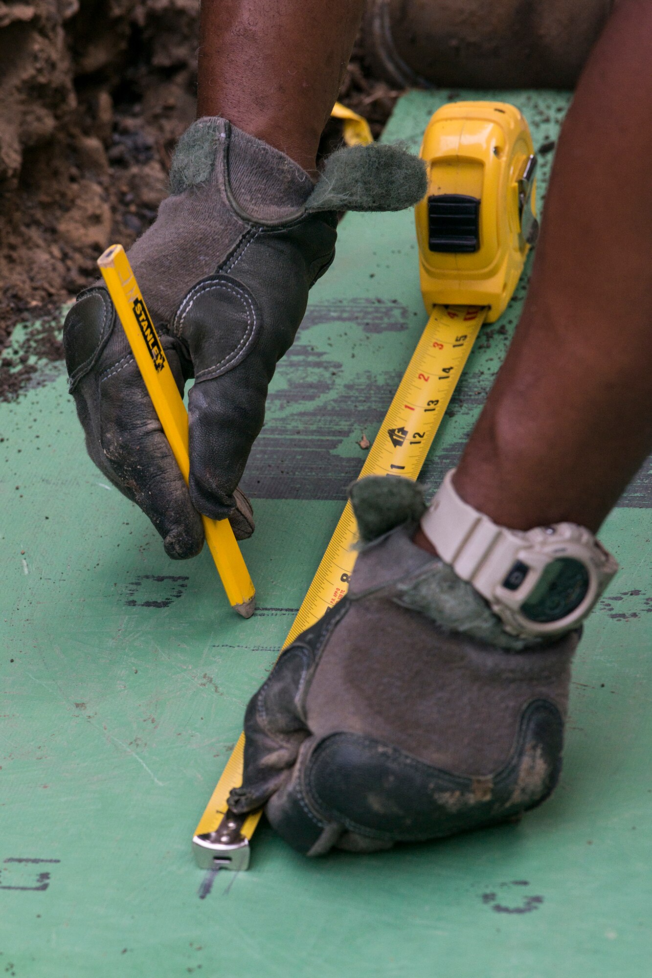 A U.S. Air Force Airman from the 307th Civil Engineering Squadron (CES) makes measurements for the installation of a water line at the Chenango County Fairgrounds, Norwich, N.Y., June 29, 2016. The 307th CES is an Air Force Reserve squadron assigned under the 307th Bomb Wing at Barksdale Air Force Base, La., and is in Norwich to participate in a community restoration project in support of the Innovative Readiness Training Program.  (U.S. Air Force photo by Master Sgt. Greg Steele/Released)