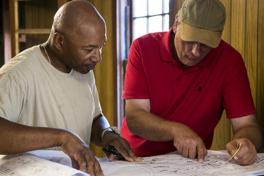 U.S. Air Force Master Sgt. Victor Fox, a 307th Civil Engineers Squadron (CES) utilities specialist, and Alan Estus, project materials manager, look over the plumbing plans for a community renovation project happening at the Chenango County Fairgrounds, Norwich, N.Y., June 30, 2016. The 307th CES is an Air Force Reserve squadron assigned under the 307th Bomb Wing at Barksdale Air Force Base, La., and is in Norwich to participate in a community restoration project in support of the Innovative Readiness Training Program.  (U.S. Air Force photo by Master Sgt. Greg Steele/Released)