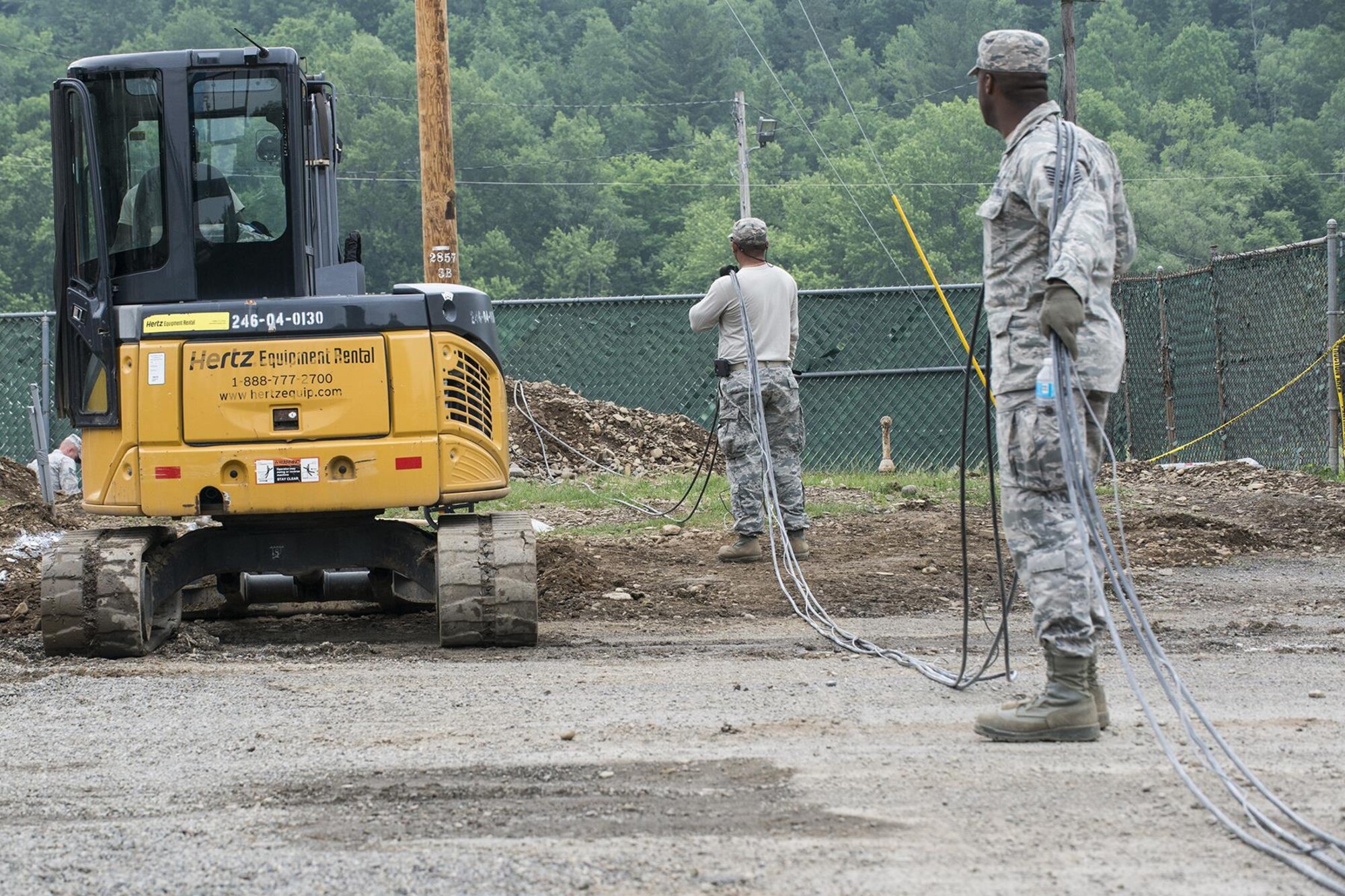 U.S. Air Force Airmen from the 307th Civil Engineering Squadron (CES) prepare to install new electrical lines at the Chenango County Fairgrounds, Norwich, N.Y., June 28, 2016. The 307th CES is an Air Force Reserve squadron assigned under the 307th Bomb Wing at Barksdale Air Force Base, La., and is in Norwich to participate in a community restoration project in support of the Innovative Readiness Training Program.  (U.S. Air Force photo by Master Sgt. Greg Steele/Released)