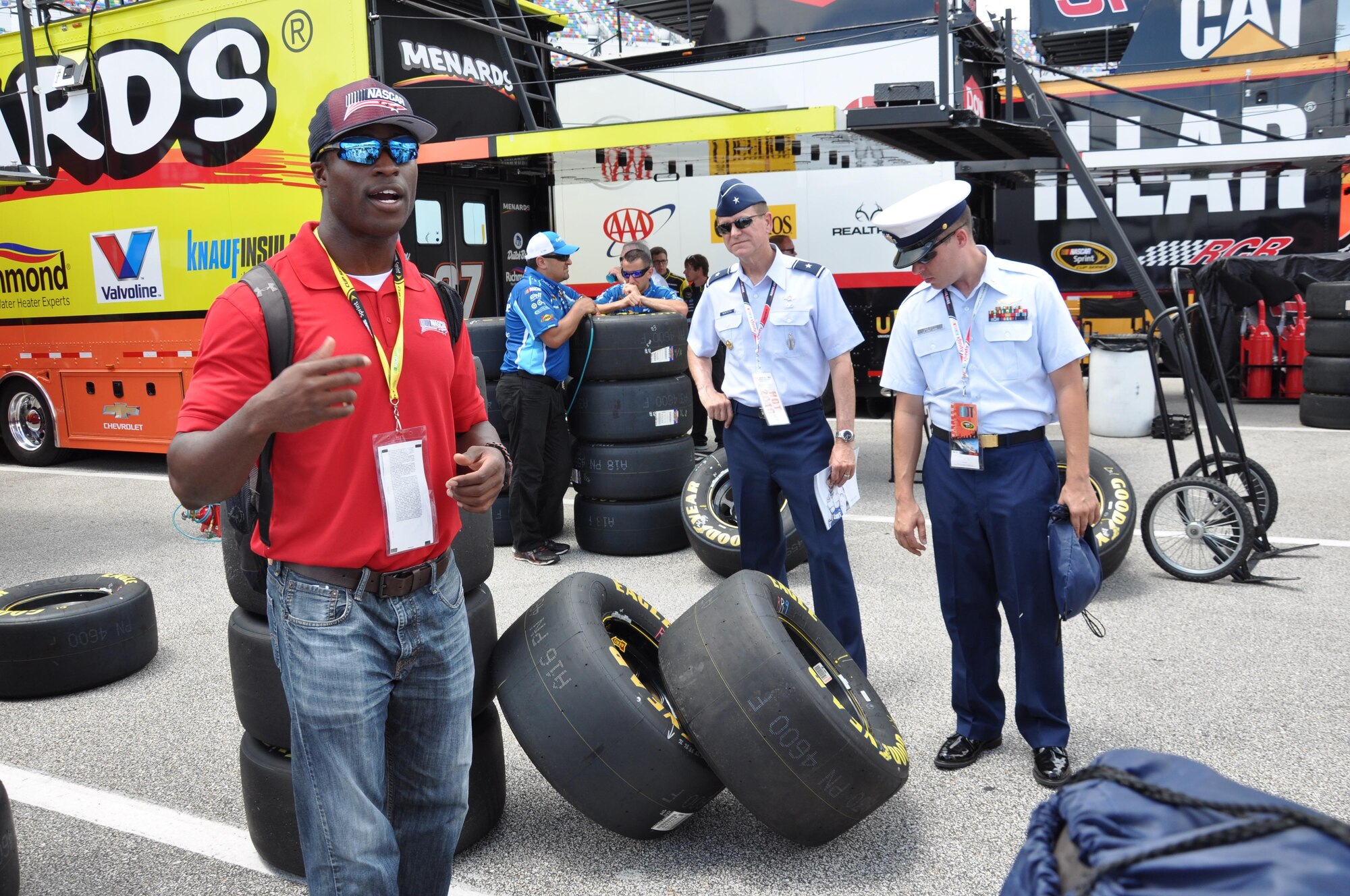 NASCAR K&N Pro Series driver and U.S. Navy Lt. Jesse Iwuji describes the science behind the different substances used in NASCAR tires at the Daytona International Speedway July 1, 2016. Members of the 45th Space Wing and other military units toured Sprint Series Cup and Xfinity garages before the start of the Subway Firecracker 250 race. (U.S. Air Force photo by 1st Lt. Alicia Premo/Released)