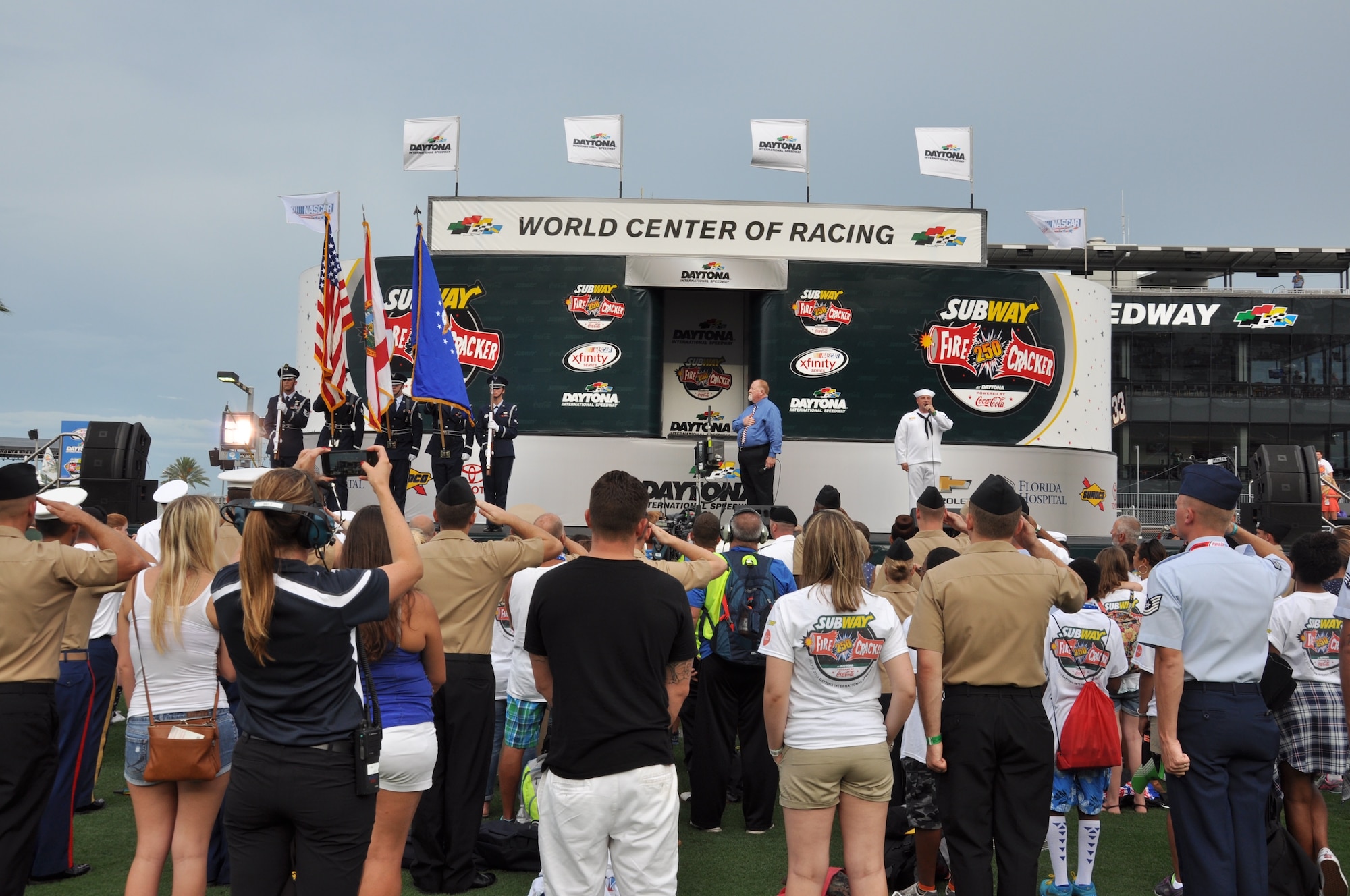 The Patrick Air Force Base Honor Guard presents colors before the start of the Subway Firecracker 250 at the Daytona International Speedway July 1, 2016. NASCAR drivers who participated in the Subway Firecracker 250 displayed active military units and installations on their windshield in this year’s ‘NASCAR: An American Salute’ program for the Independence Day weekend. (U.S. Air Force photo by 1st Lt. Alicia Premo/Released)