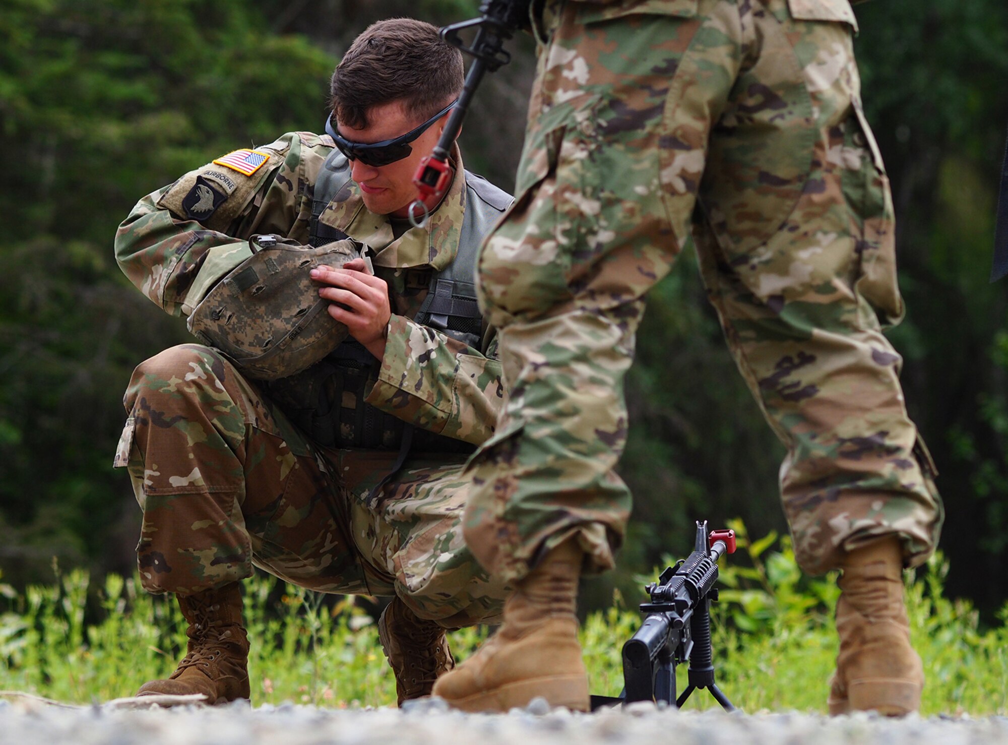 Army Sgt. Patric Carroll, a native of Englewood, Tenn., assigned to the 539th Composite Truck Company (Light), 17th Combat Sustainment Support Battalion, U.S. Army Alaska, adjusts his helmet straps before a Situation Exercise Training lane during the Ready Warrior Competition at Camp Madbull on Joint Base Elmendorf-Richardson, Alaska, Thursday, June 23, 2016.  The three-day competition tested teams of Soldiers in physical fitness, small arms proficiency, land navigation, and small-unit tactics as well as other Soldier skills. (U.S. Air Force photo/Justin Connaher)