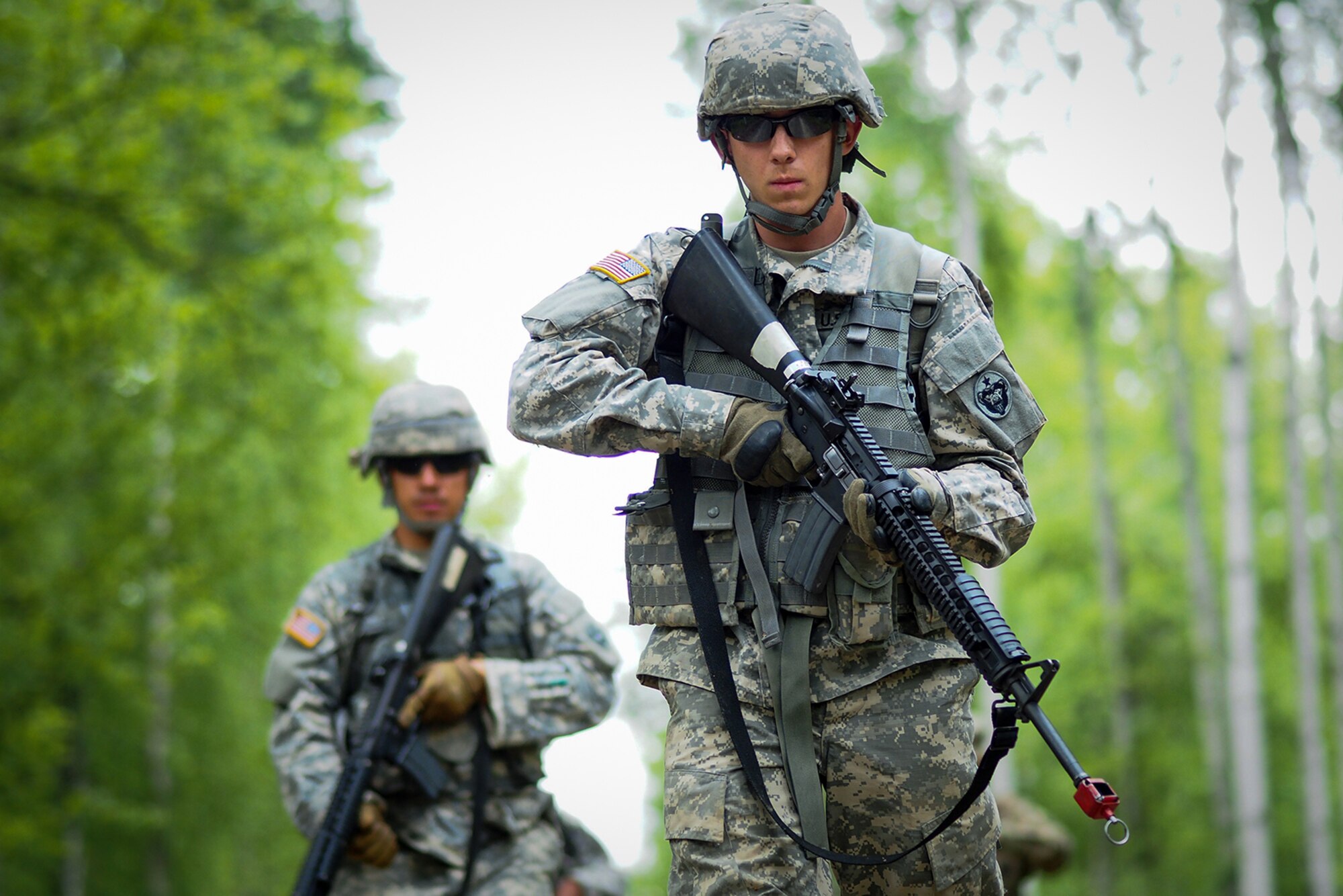 Army Pfc. Richard Burger, a native of Independence, Mo., assigned to the 574th Quartermaster Company, 17th Combat Sustainment Support Battalion, U.S. Army Alaska, leads his team team on point through a Situation Exercise Training lane during the Ready Warrior Competition at Camp Madbull on Joint Base Elmendorf-Richardson, Alaska, Thursday, June 23, 2016.  The three-day competition tested teams of Soldiers in physical fitness, small arms proficiency, land navigation, and small-unit tactics as well as other Soldier skills. (U.S. Air Force photo/Justin Connaher)