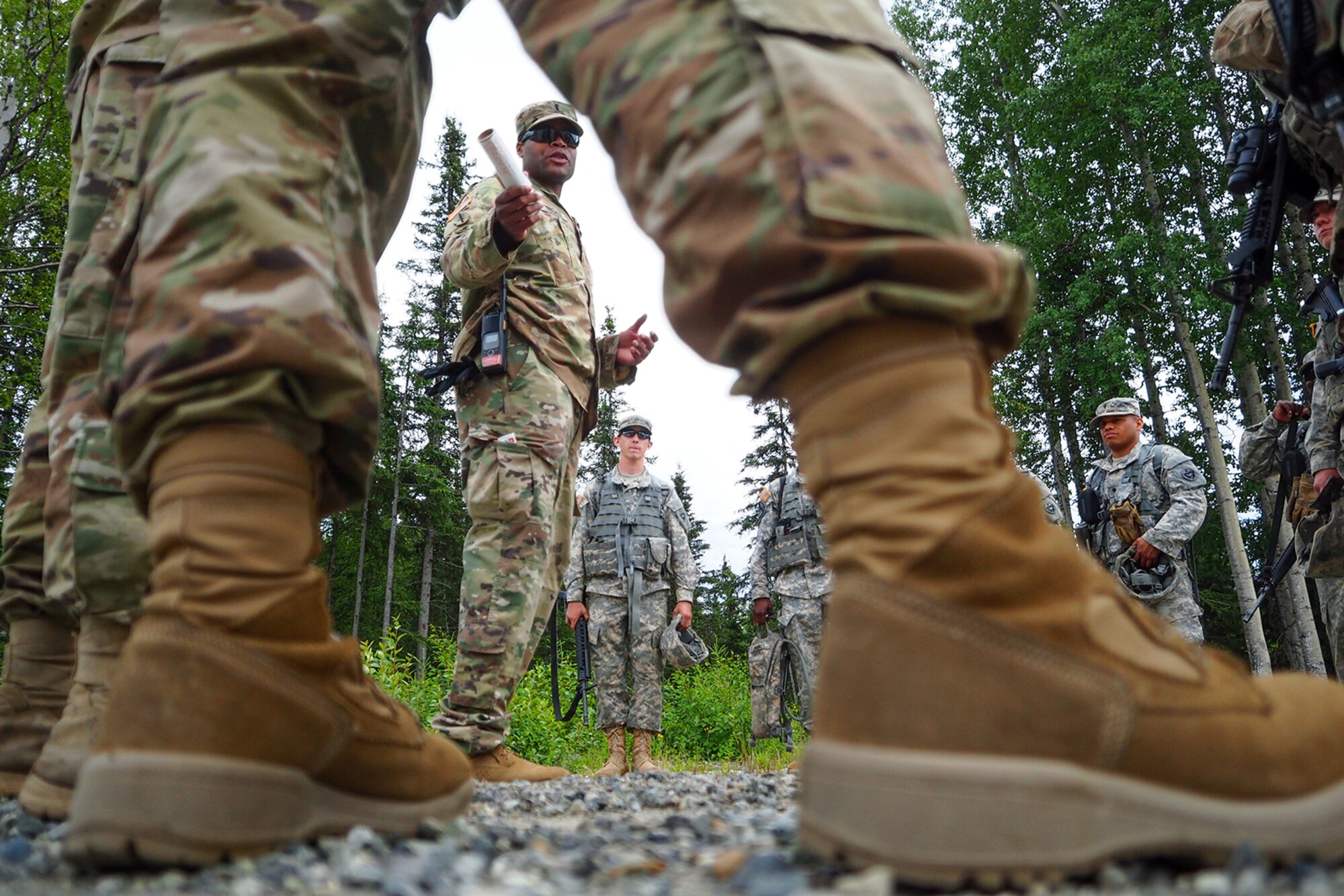 Army 1st Lt. Herman Tisdale, a native of Charleston, S.C., assigned to the 17th Combat Sustainment Support Battalion, U.S. Army Alaska, briefs Soldiers in preparation for a Situation Exercise Training lane during the Ready Warrior Competition at Camp Madbull on Joint Base Elmendorf-Richardson, Alaska, Thursday, June 23, 2016.  The three-day competition tested teams of Soldiers in physical fitness, small arms proficiency, land navigation, and small-unit tactics as well as other Soldier skills. (U.S. Air Force photo/Justin Connaher)