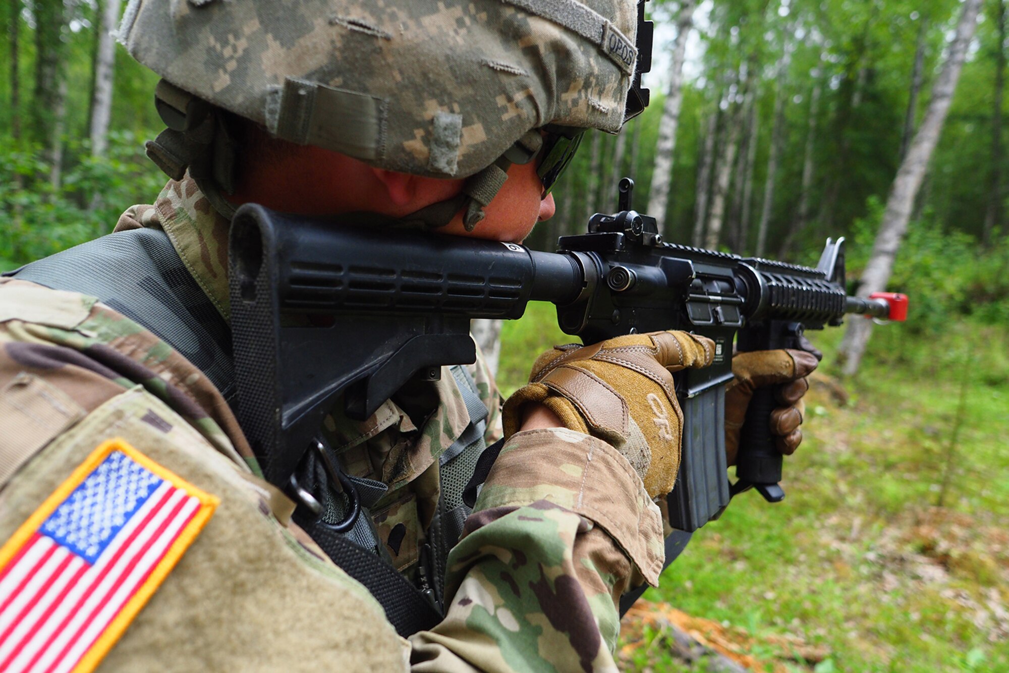 Spc. Steven Wolfe, a native of Tacoma, Wash., assigned to the 539th Composite Truck Company (Light), 17th Combat Sustainment Support Battalion, U.S. Army Alaska, provides security on a Situation Exercise Training lane during the Ready Warrior Competition at Camp Madbull on Joint Base Elmendorf-Richardson, Alaska, Thursday, June 23, 2016.  The three-day competition tested teams of Soldiers in physical fitness, small arms proficiency, land navigation, and small-unit tactics as well as other Soldier skills. (U.S. Air Force photo/Justin Connaher)