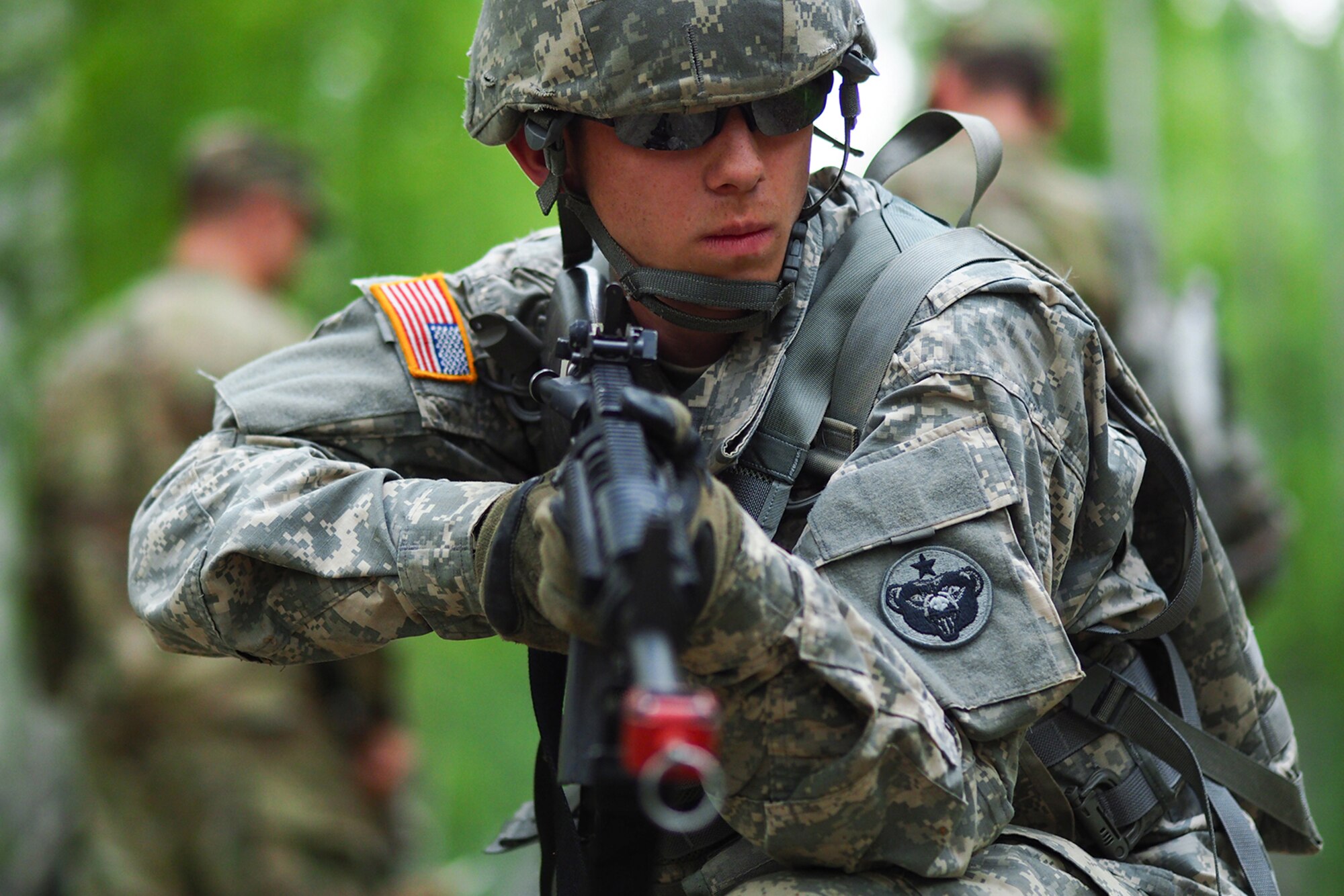 Army Pfc. Richard Burger, a native of Independence, Mo., assigned to the 574th Quartermaster Company, 17th Combat Sustainment Support Battalion, U.S. Army Alaska, pulls security as fellow Soldiers provide medical attention to a simulated casualty on a Situation Exercise Training lane during the Ready Warrior Competition at Camp Madbull on Joint Base Elmendorf-Richardson, Alaska, Thursday, June 23, 2016.  The three-day competition tested teams of Soldiers in physical fitness, small arms proficiency, land navigation, and small-unit tactics as well as other Soldier skills. (U.S. Air Force photo/Justin Connaher)