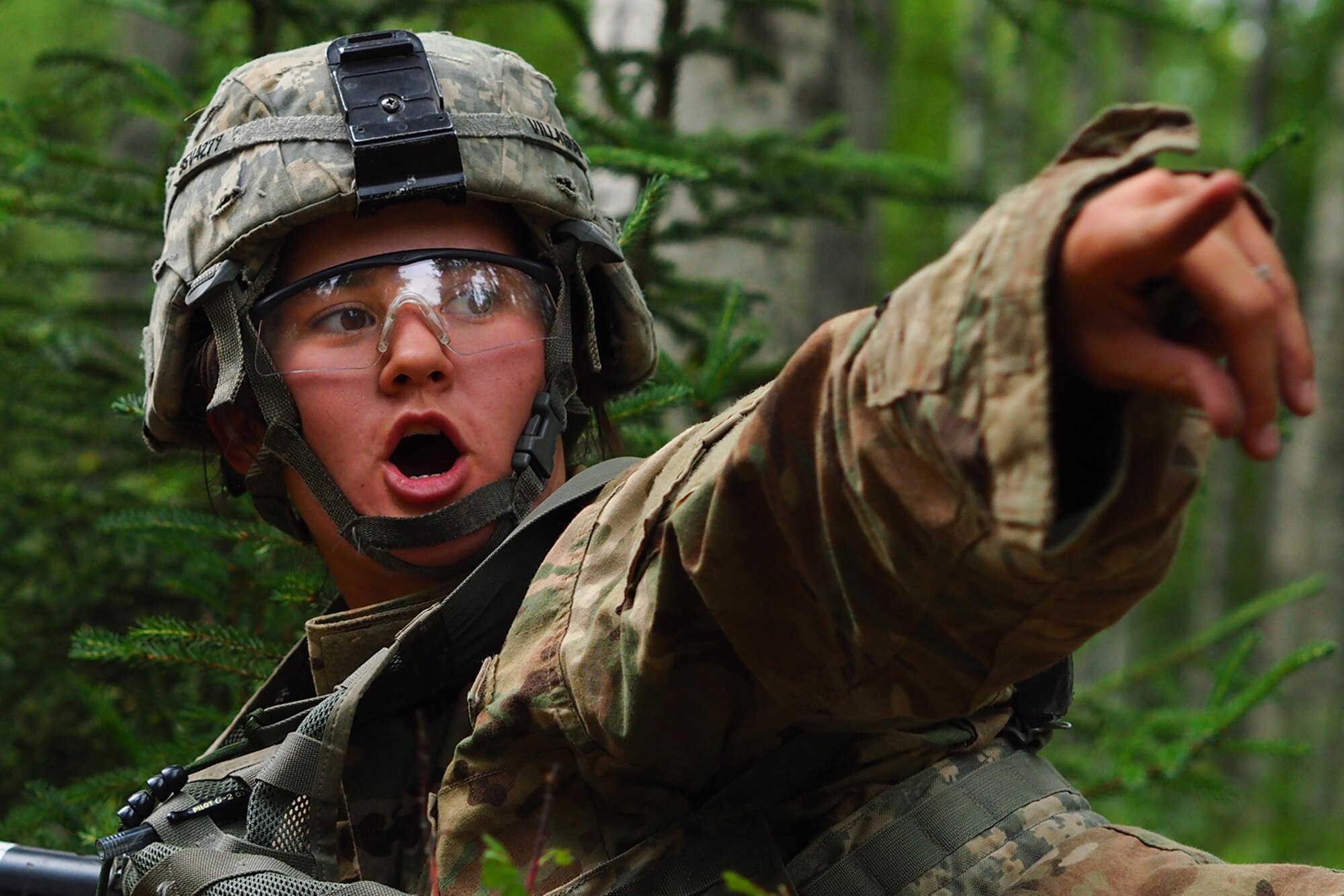 Army Sgt. Jessica Belcher, a native of Valparaiso, Ind., assigned to the 17th Combat Sustainment Support Battalion, U.S. Army Alaska, yells an order for her team for bound forward on a Situation Exercise Training lane during the Ready Warrior Competition at Camp Madbull on Joint Base Elmendorf-Richardson, Alaska, Thursday, June 23, 2016.  The three-day competition tested teams of Soldiers in physical fitness, small arms proficiency, land navigation, and small-unit tactics as well as other Soldier skills. (U.S. Air Force photo/Justin Connaher)