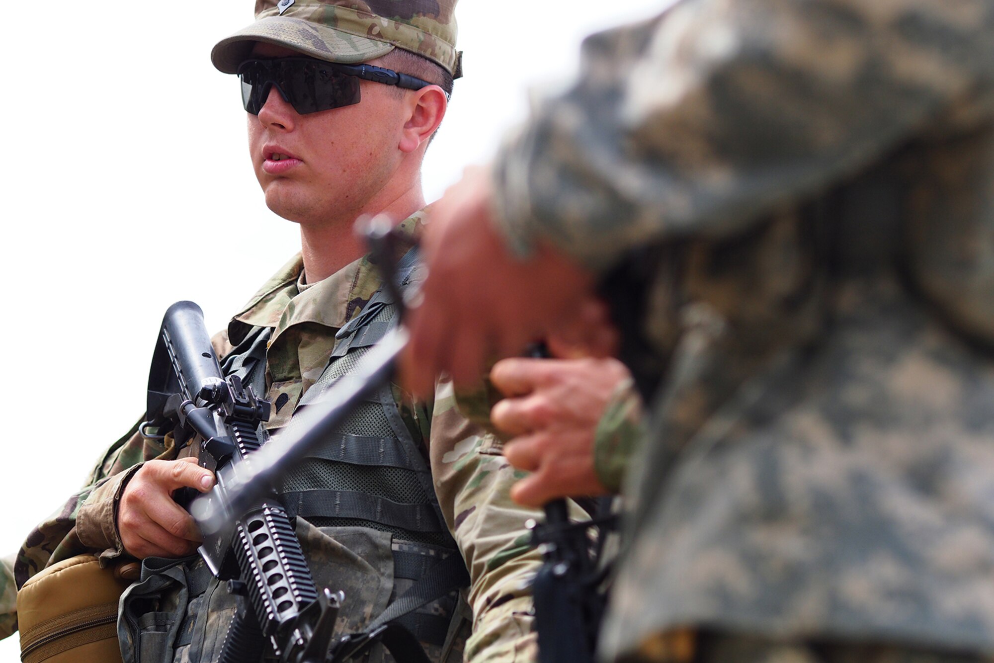 Spc. Steven Wolfe, a native of Tacoma, Wash., assigned to the 539th Composite Truck Company (Light), 17th Combat Sustainment Support Battalion, U.S. Army Alaska, listens to a safety briefing before a Situation Exercise Training lane during the Ready Warrior Competition at Camp Madbull on Joint Base Elmendorf-Richardson, Alaska, Thursday, June 23, 2016.  The three-day competition tested teams of Soldiers in physical fitness, small arms proficiency, land navigation, and small-unit tactics as well as other Soldier skills. (U.S. Air Force photo/Justin Connaher)