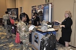 DLA Troop Support representative Sally Pooler (right) answers questions from a soldier at the DLA Warfighter Support Initiative, Fort Bragg, North Carolina.