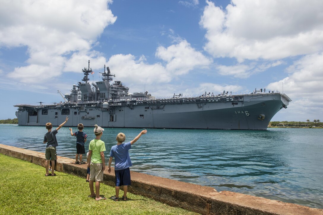 The USS America arrives at Joint Base Pearl Harbor-Hickam, Hawaii, June 30, 2016, for Rim of the Pacific 2016. Twenty-six nations, more than 40 ships and submarines, more than 200 aircraft and 25,000 personnel are participating in the exercise, running through Aug. 4. Navy photo by Petty Officer 1st Class John Herman
